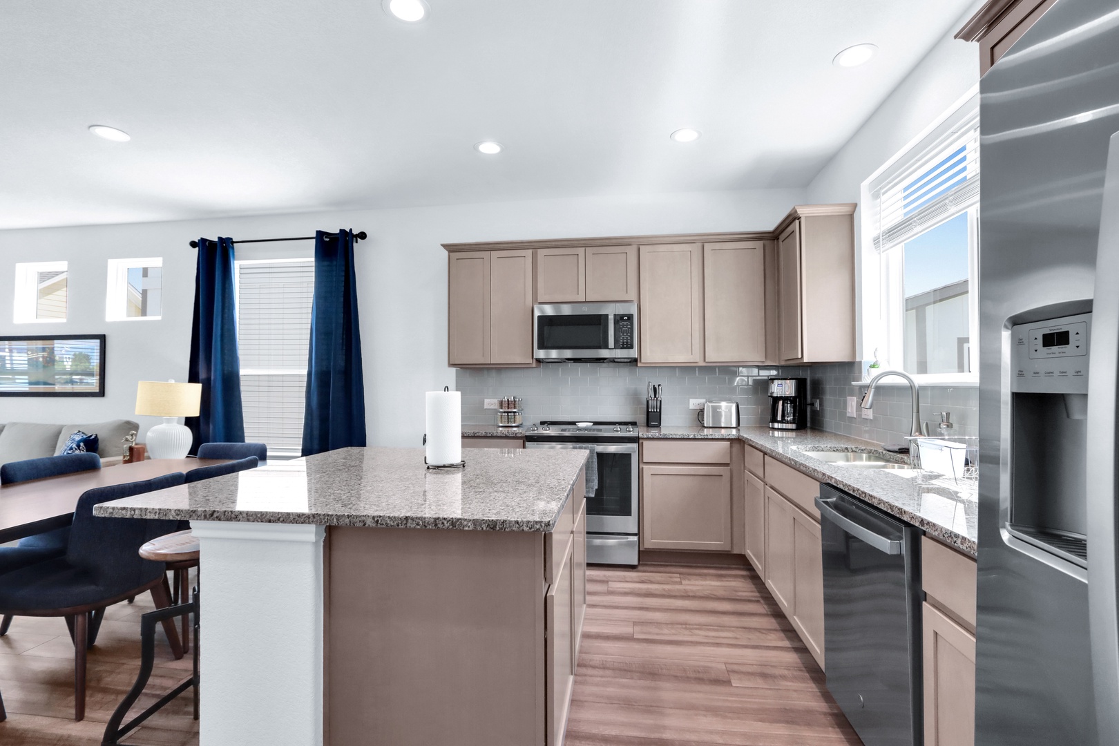 The airy, open kitchen offers ample space & all the comforts of home