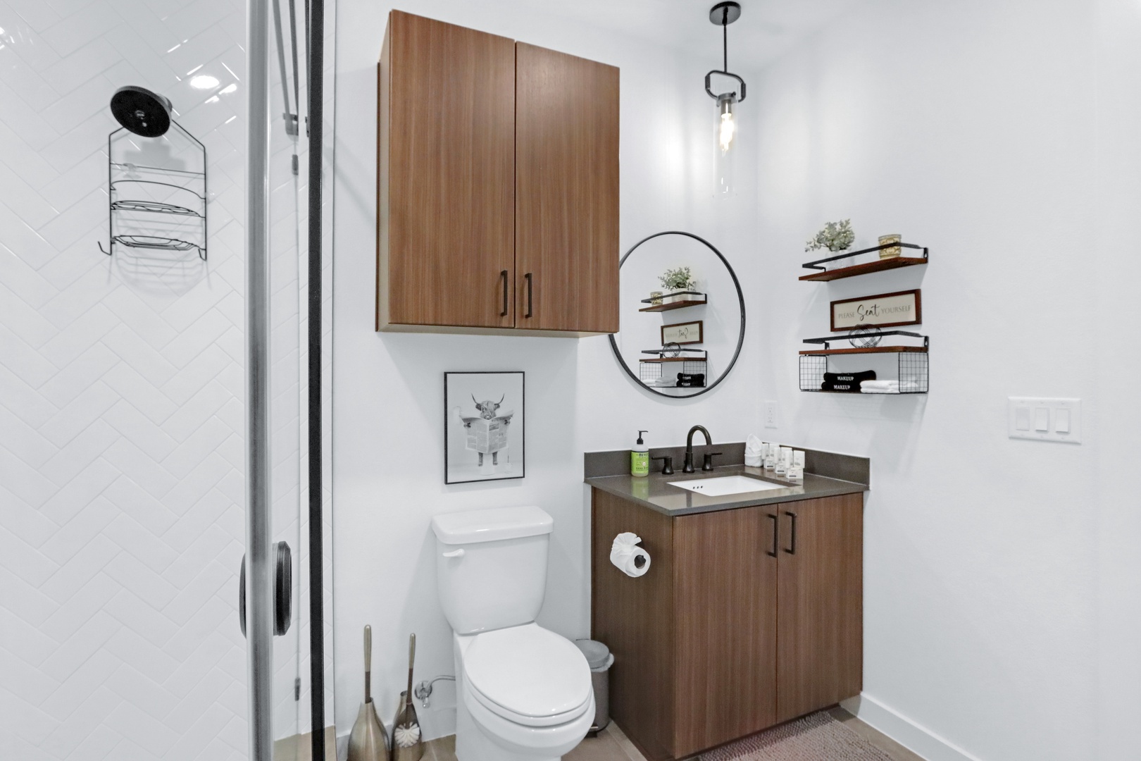 A single vanity & glass shower awaits in the full bathroom