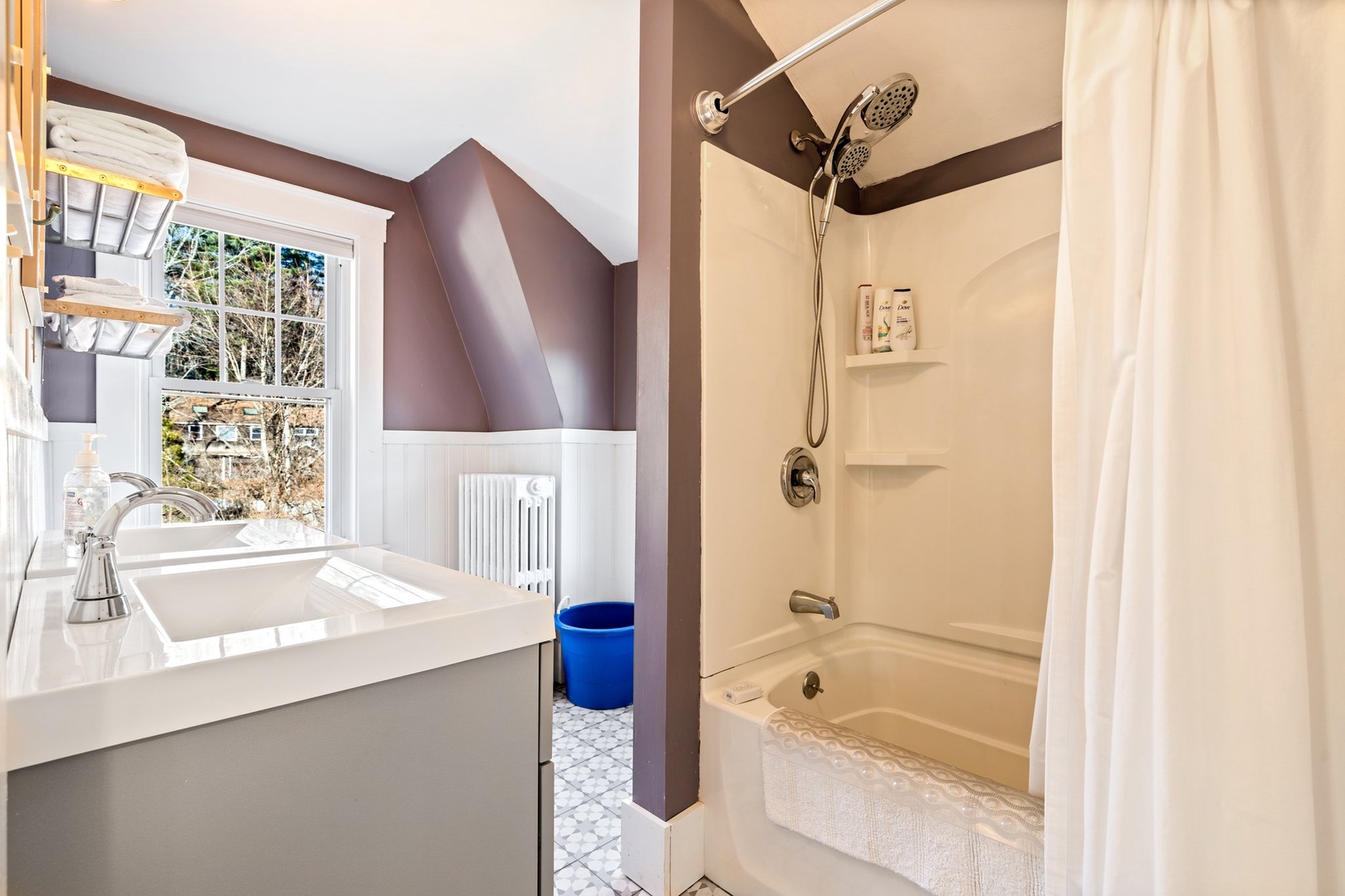 A double vanity, shower/tub combo available on the first floor shared bath