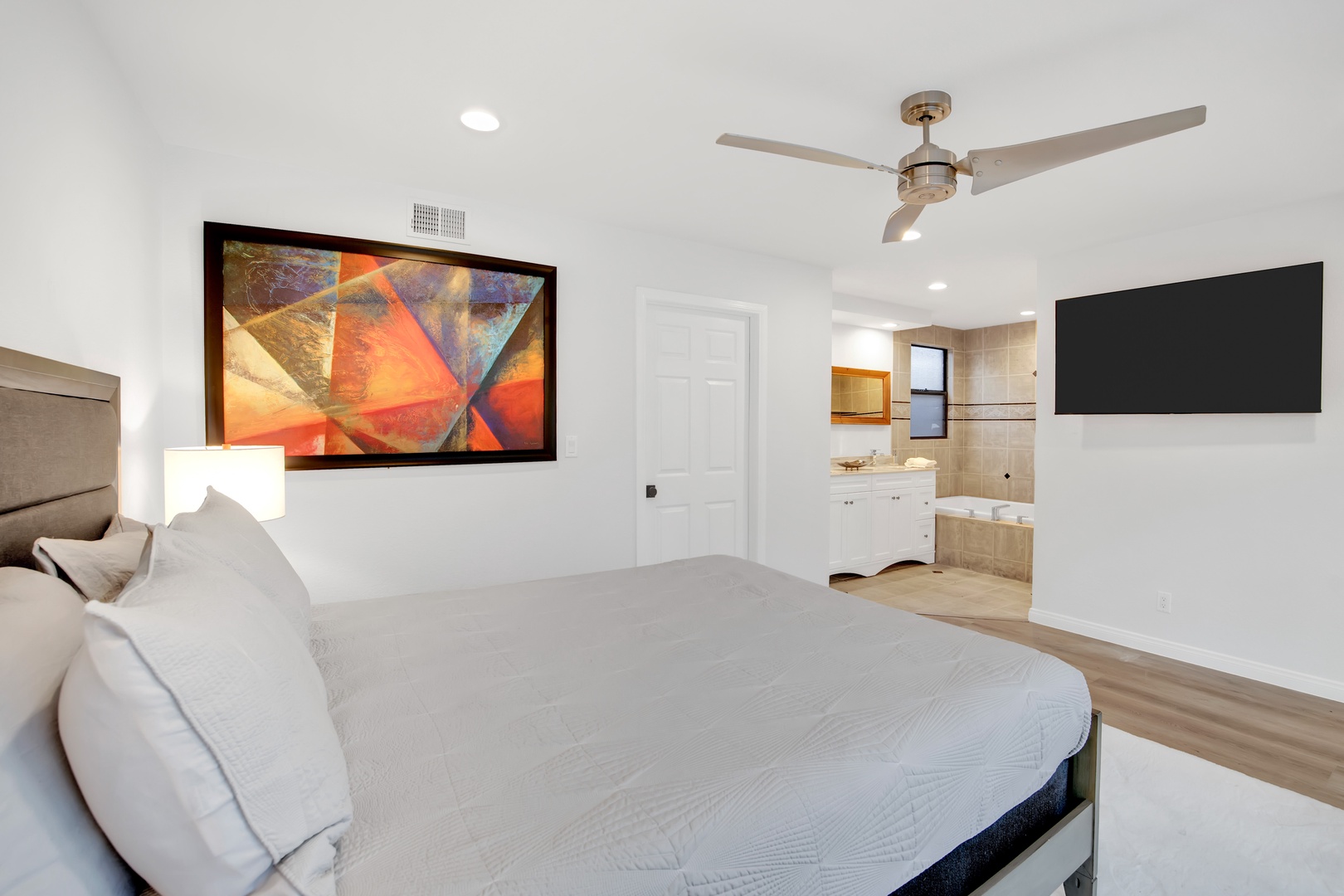 Bedroom 2 with Queen bed, Smart TV, and en-suite