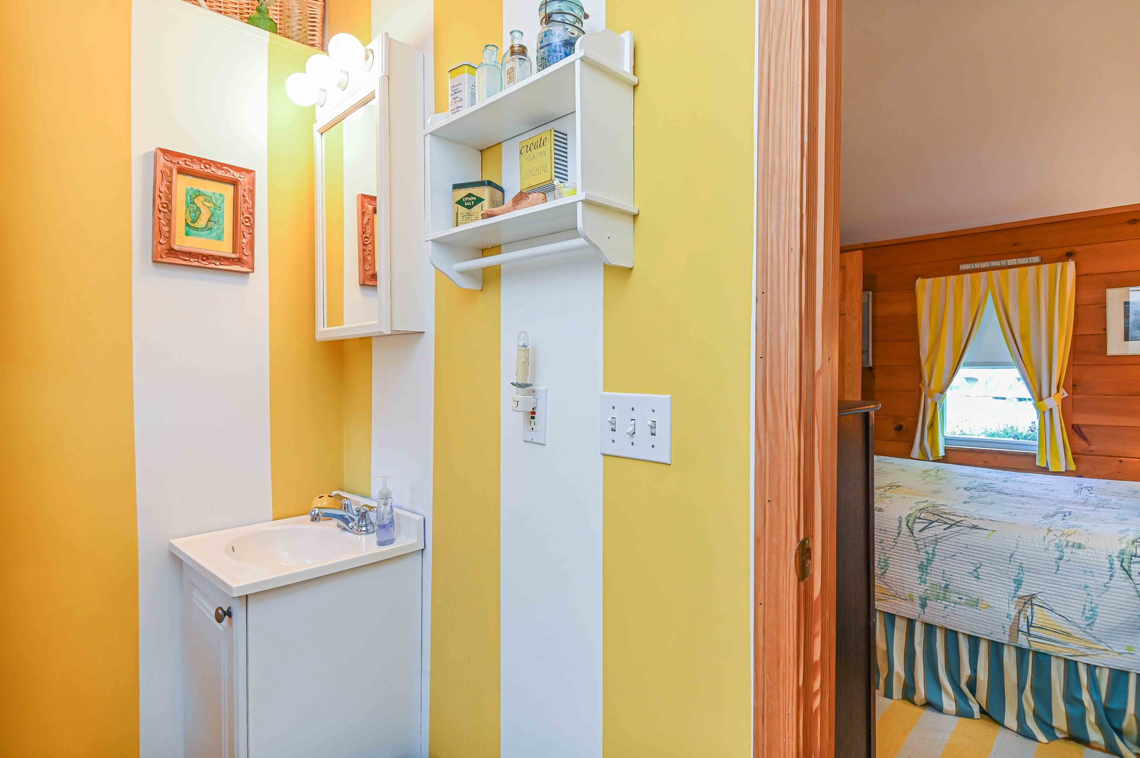 A shower/tub combo & single vanity await in this ensuite/shared bath