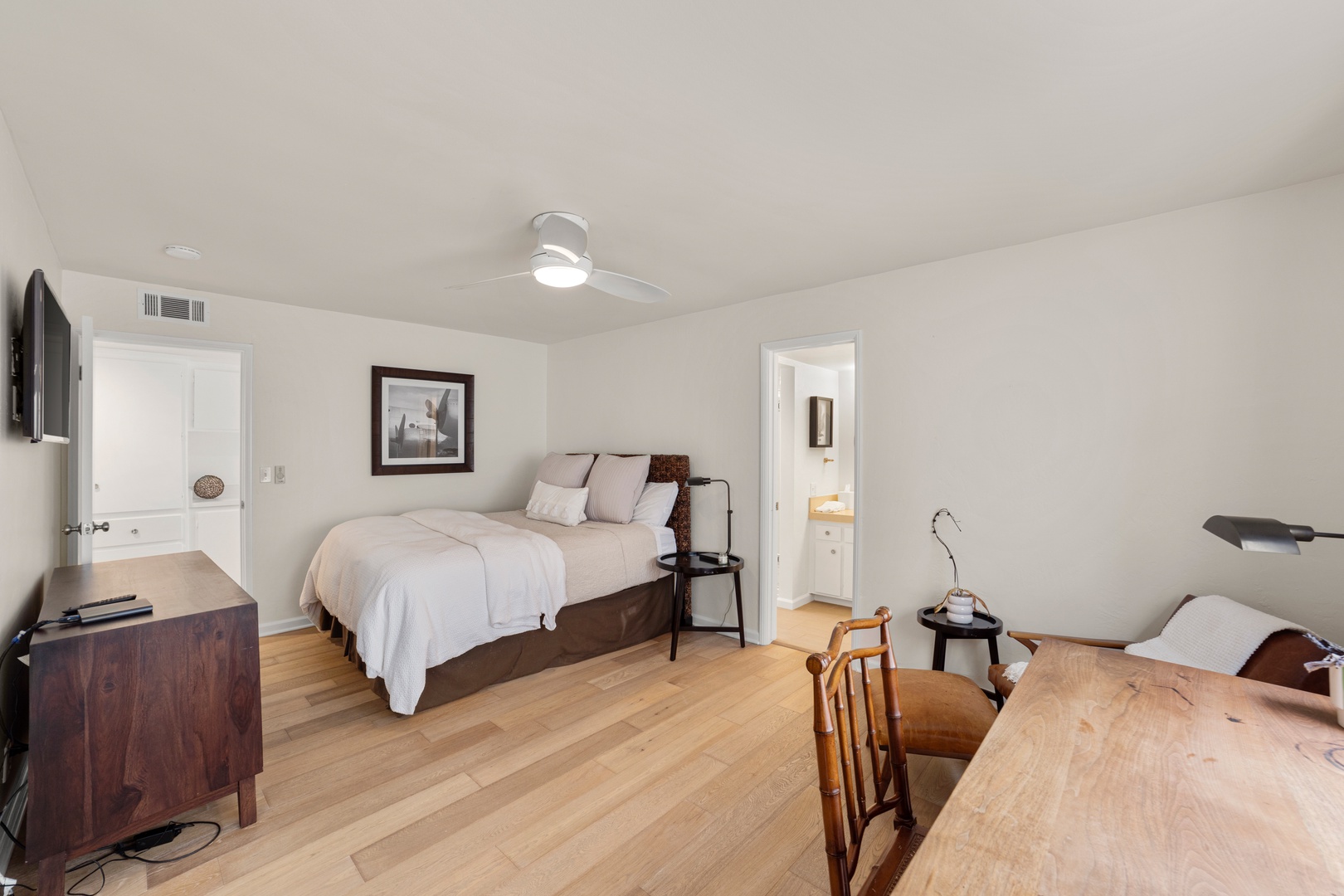 The second bedroom boasts a regal queen bed, smart TV, & ensuite