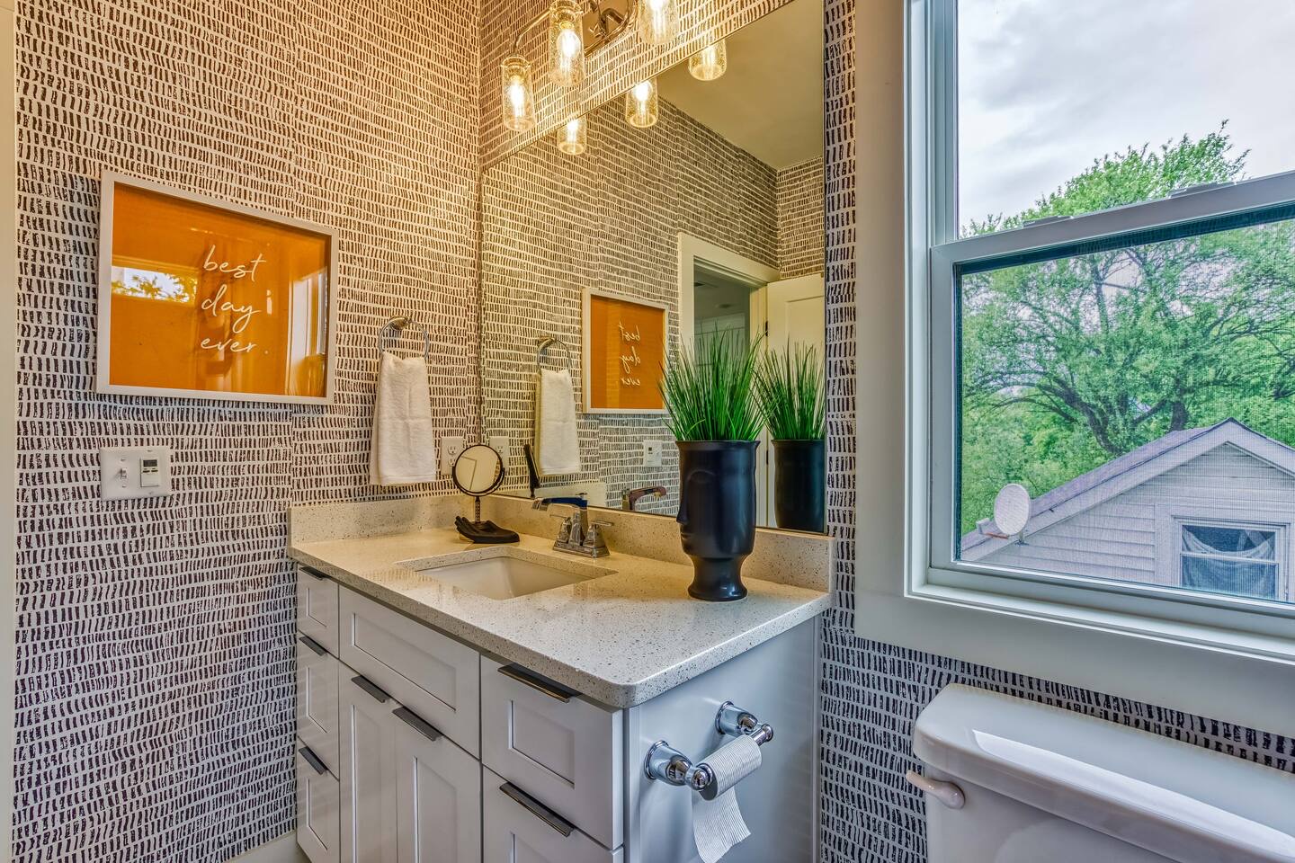 The full bath on the 2nd floor offers a large single vanity & shower/tub combo