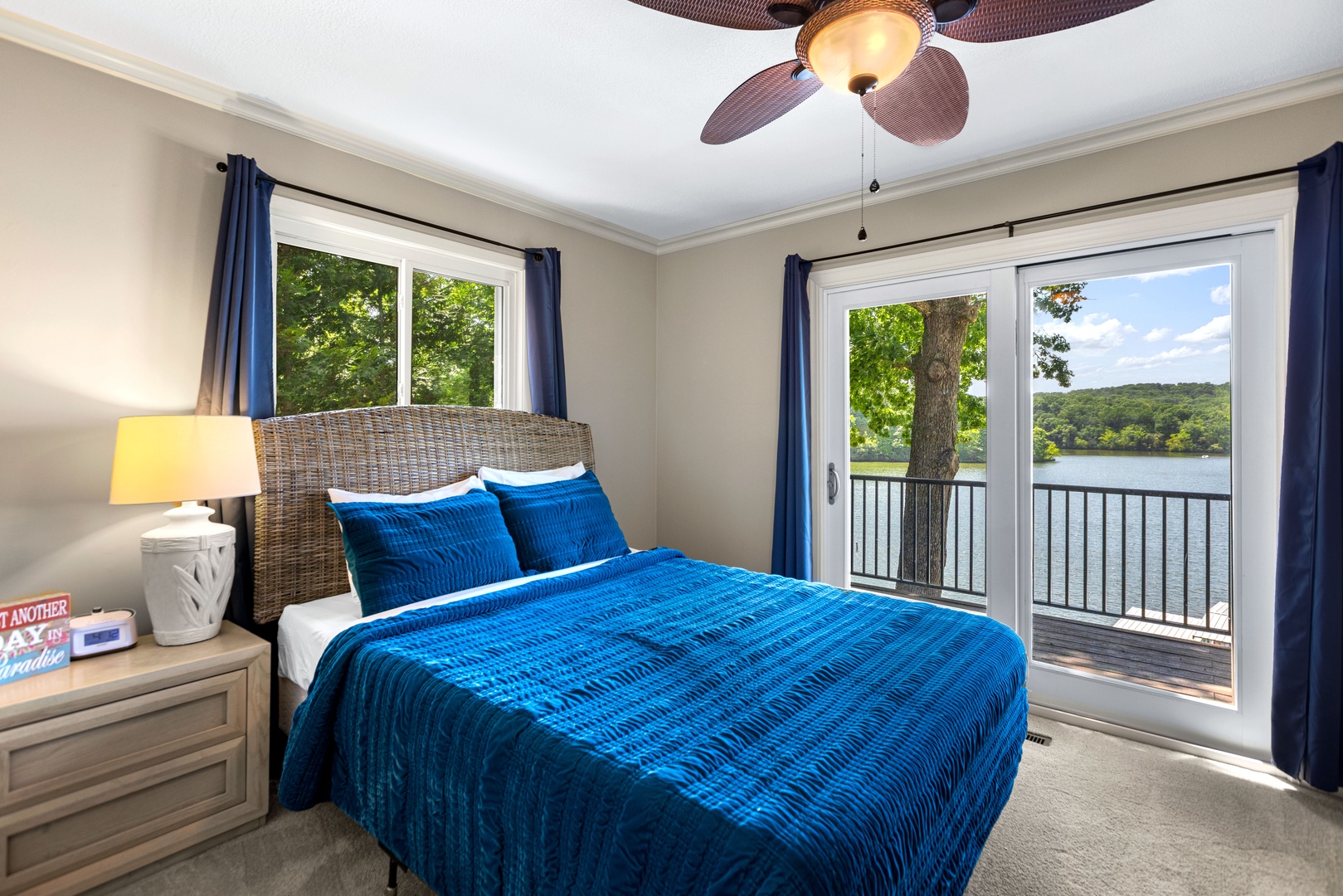 This serene bedroom retreat includes a plush queen bed and deck access