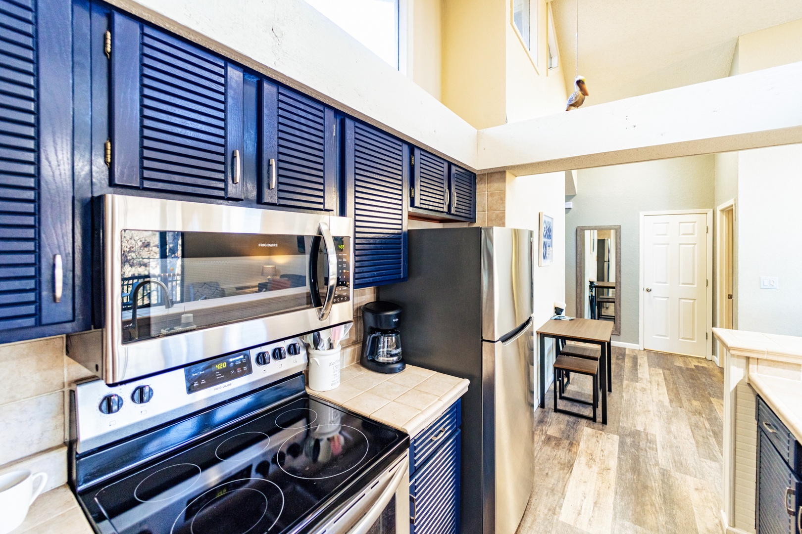 The airy, open kitchen offers ample space & all the comforts of home
