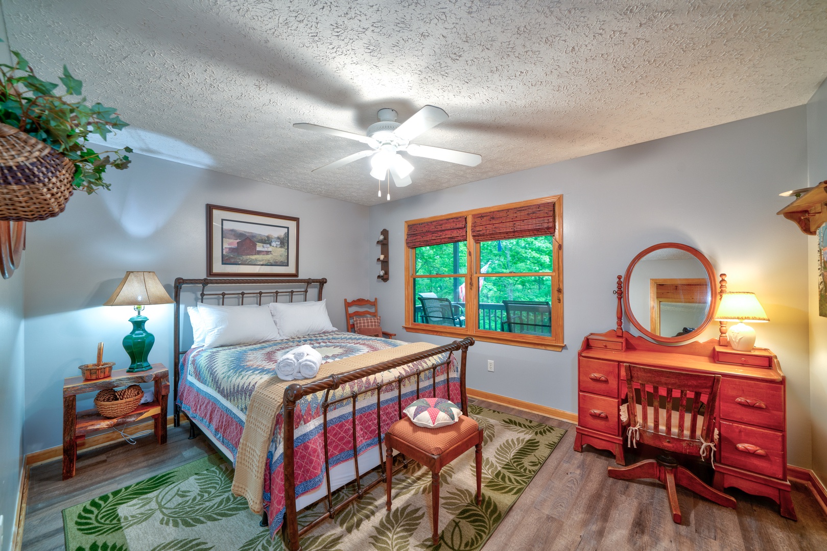 This serene main-level bedroom includes a plush queen-sized bed