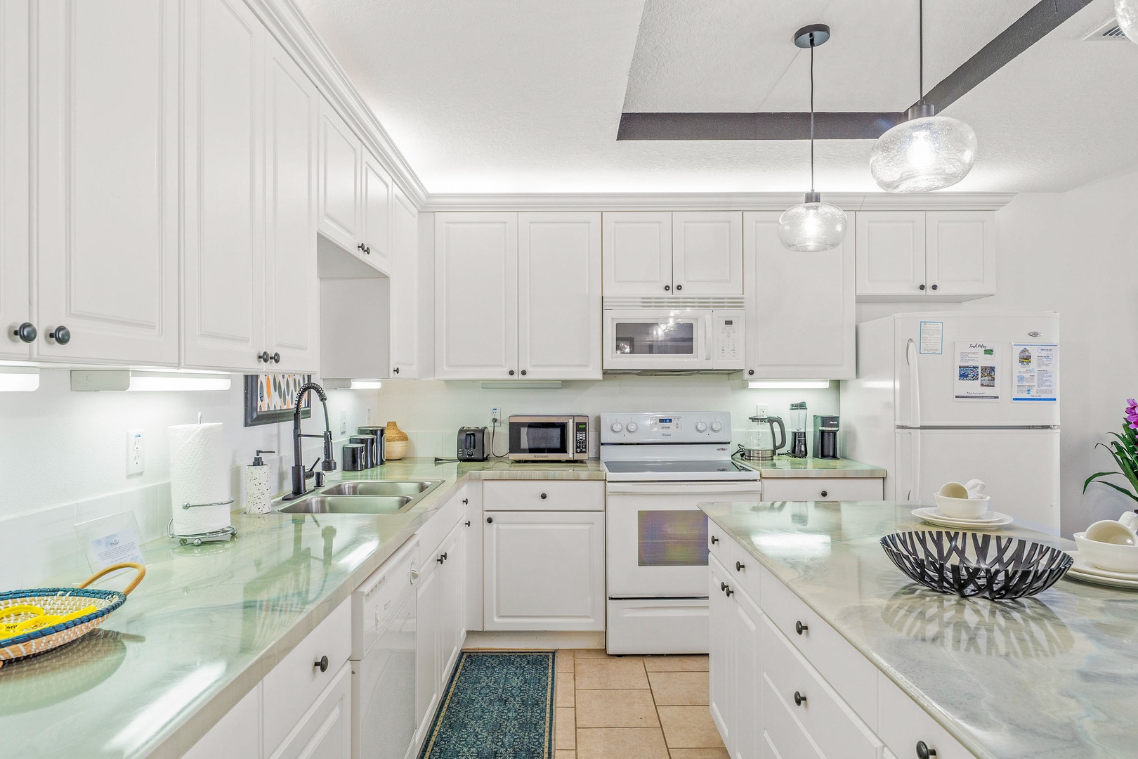 The kitchen offers ample storage space & all the comforts of home
