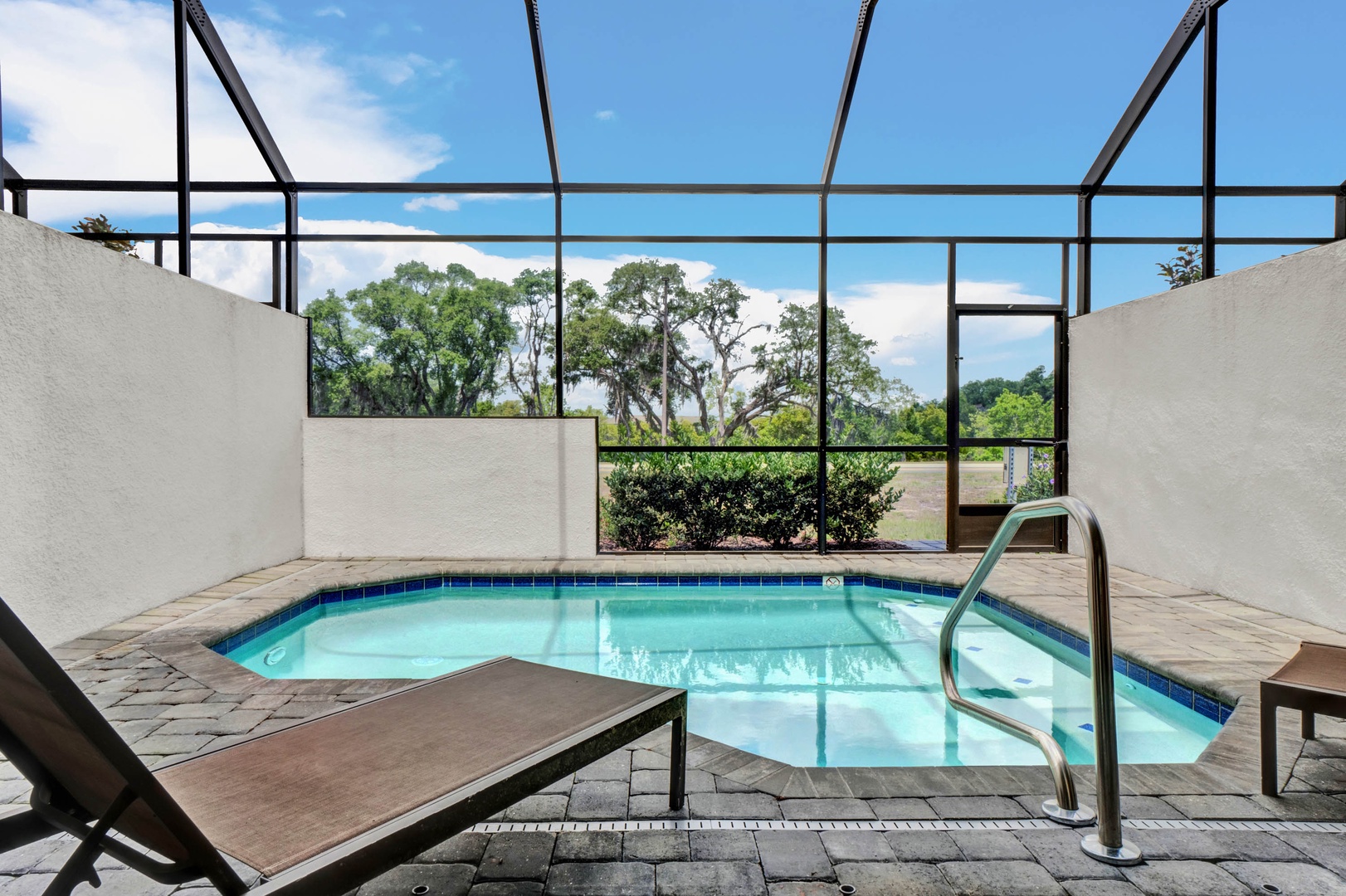 Private screened pool with outdoor seating