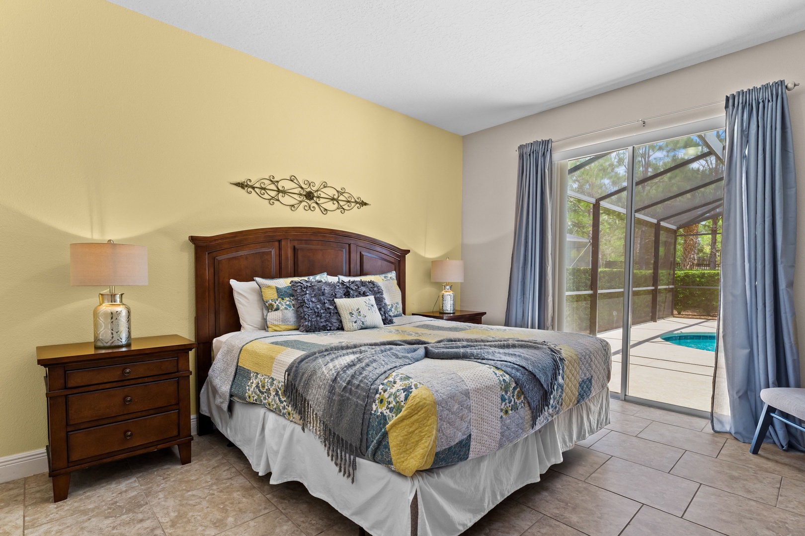 Bedroom 1 with king bed, Smart TV, patio access, and ensuite bathroom