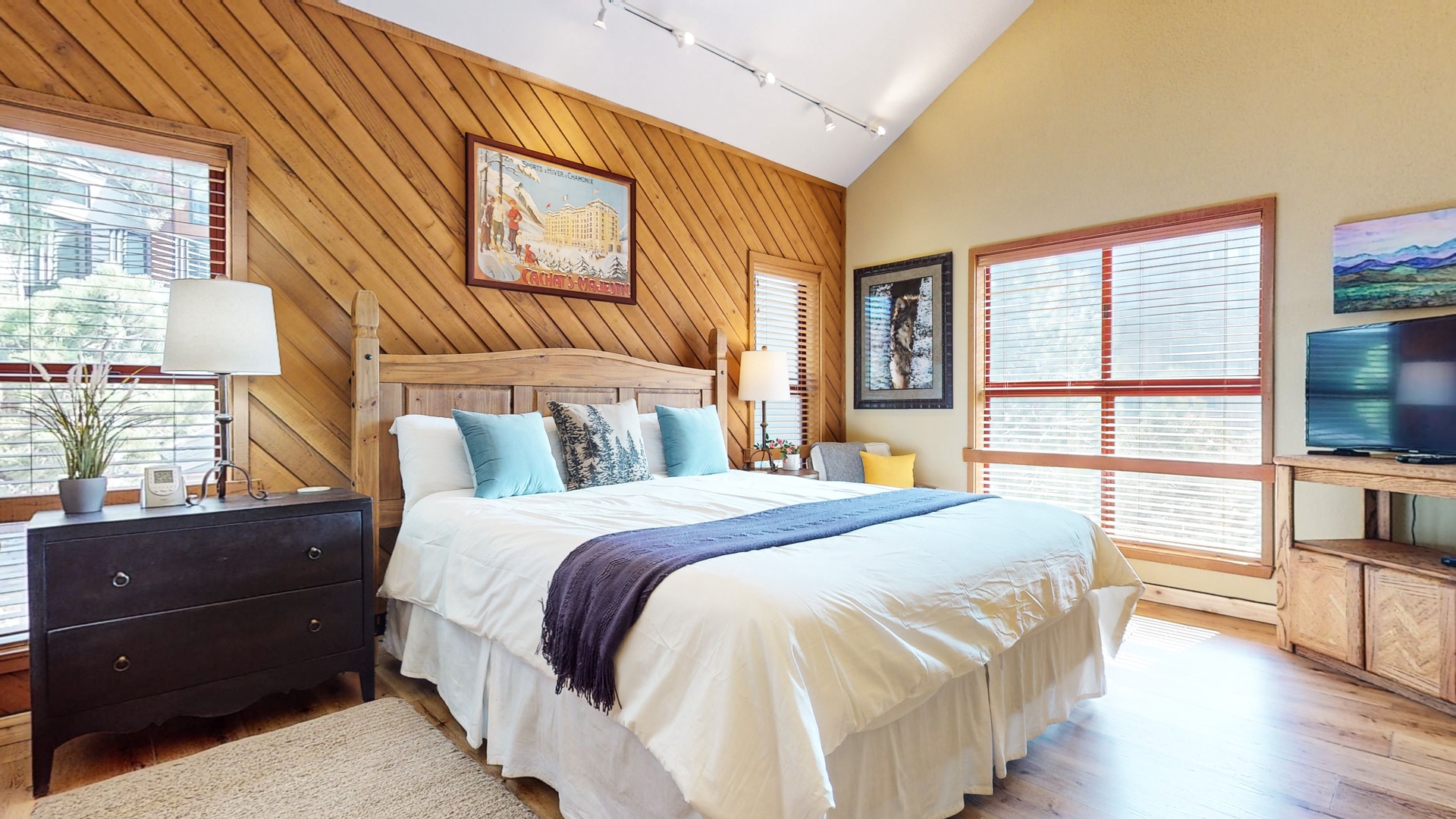 Bedroom 1 with Cal-King bed, smart TV, and en-suite