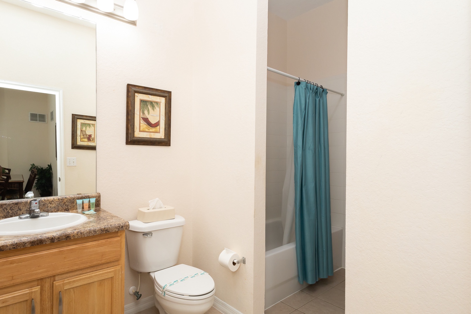 The second full en suite includes a single vanity & shower/tub combo