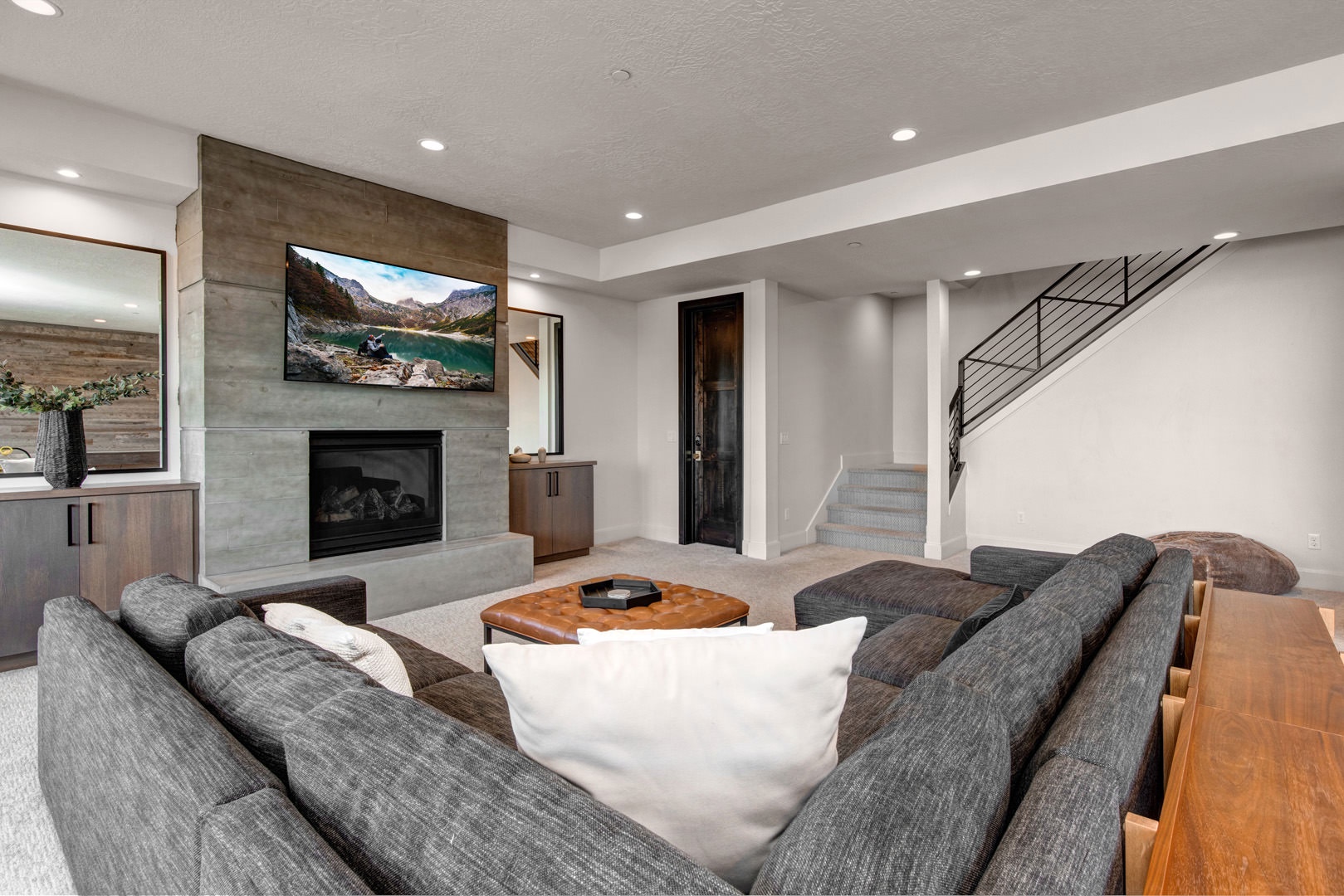 Cozy and spacious living area with TV and fireplace