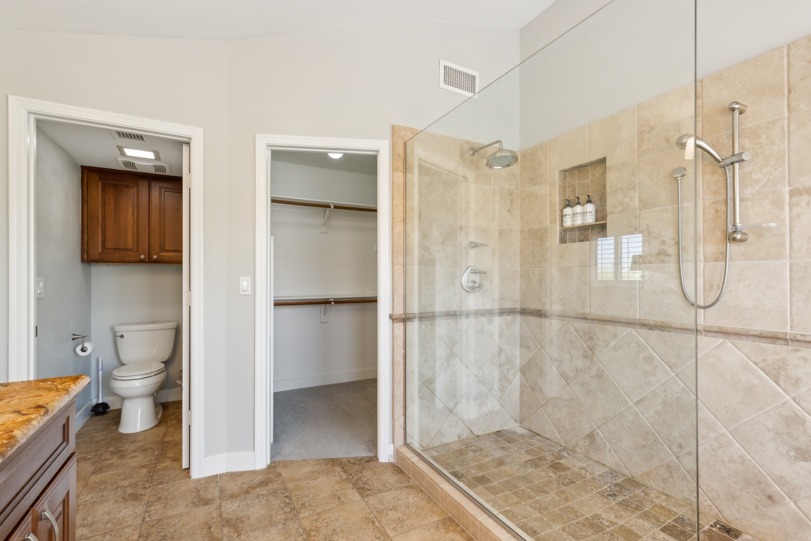 Ensuite bathroom with dual sinks, and walk-in shower with dual shower heads