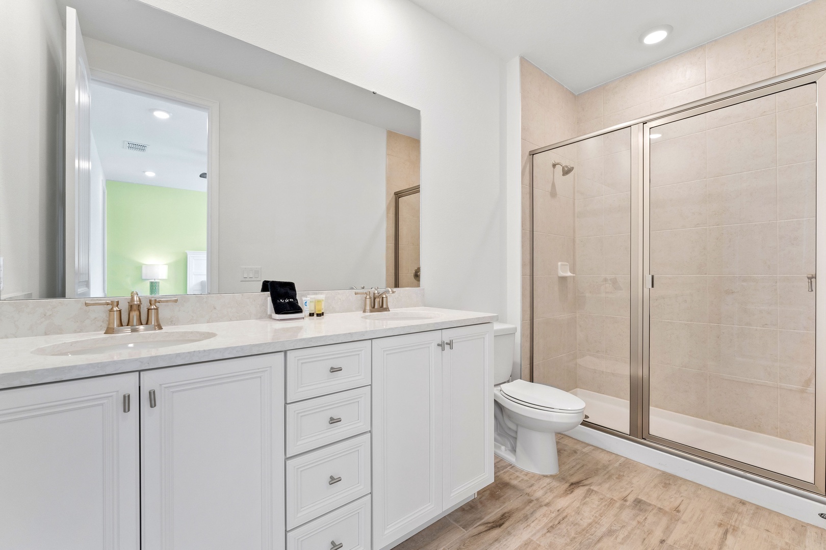 A double vanity & walk-in shower is available in this ensuite bath