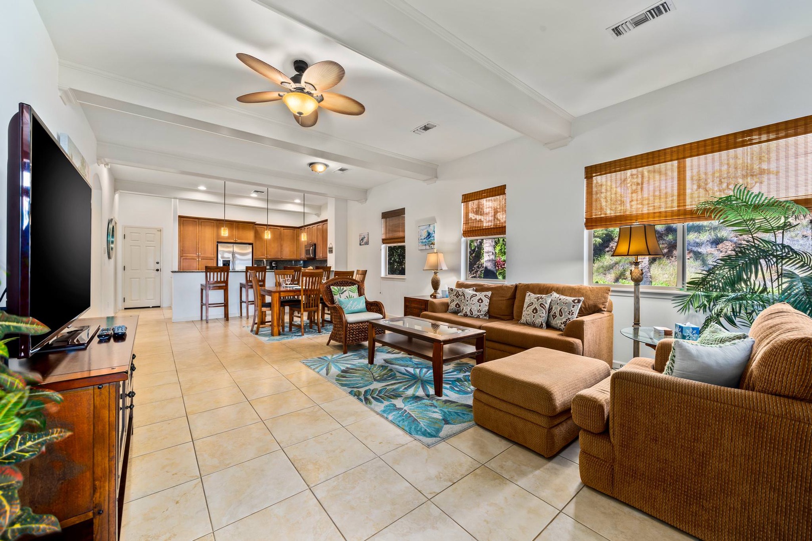Tropical living room with flat screen TV and lanai access