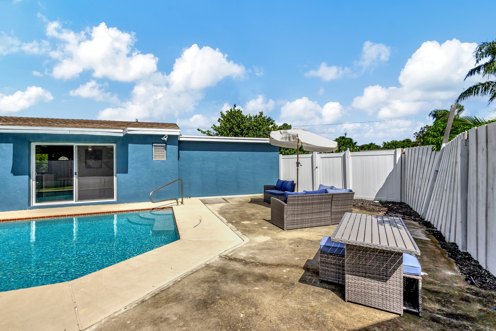 Back yard with private pool and outdoor seating