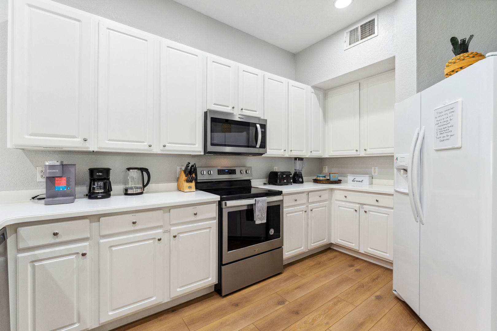 The open, airy kitchen offers ample space & all the comforts of home