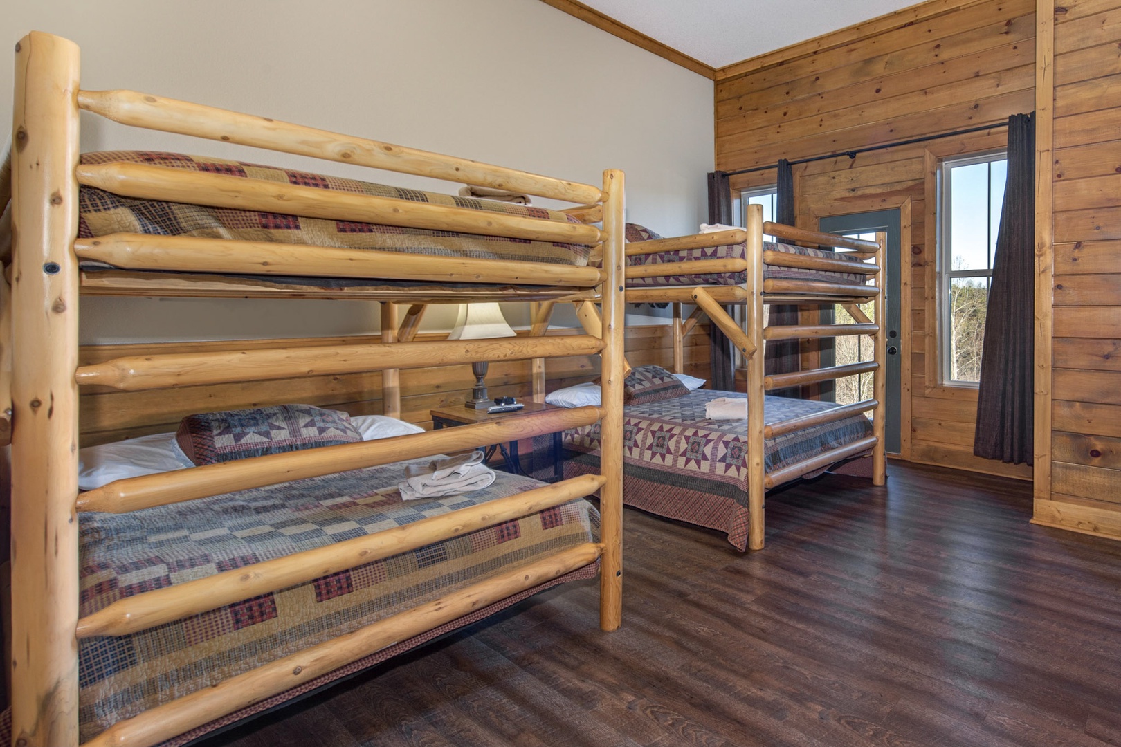This 1st floor bedroom includes full-over-full bunk beds, ensuite, balcony, & TV