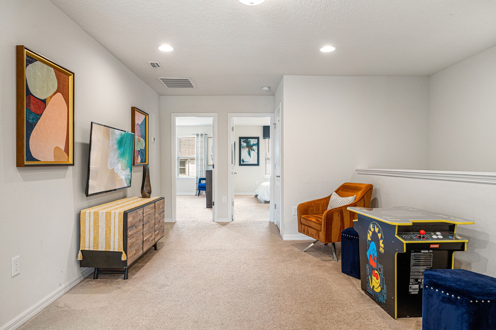 Cozy loft vibes with a smart TV and classic Pac-Man