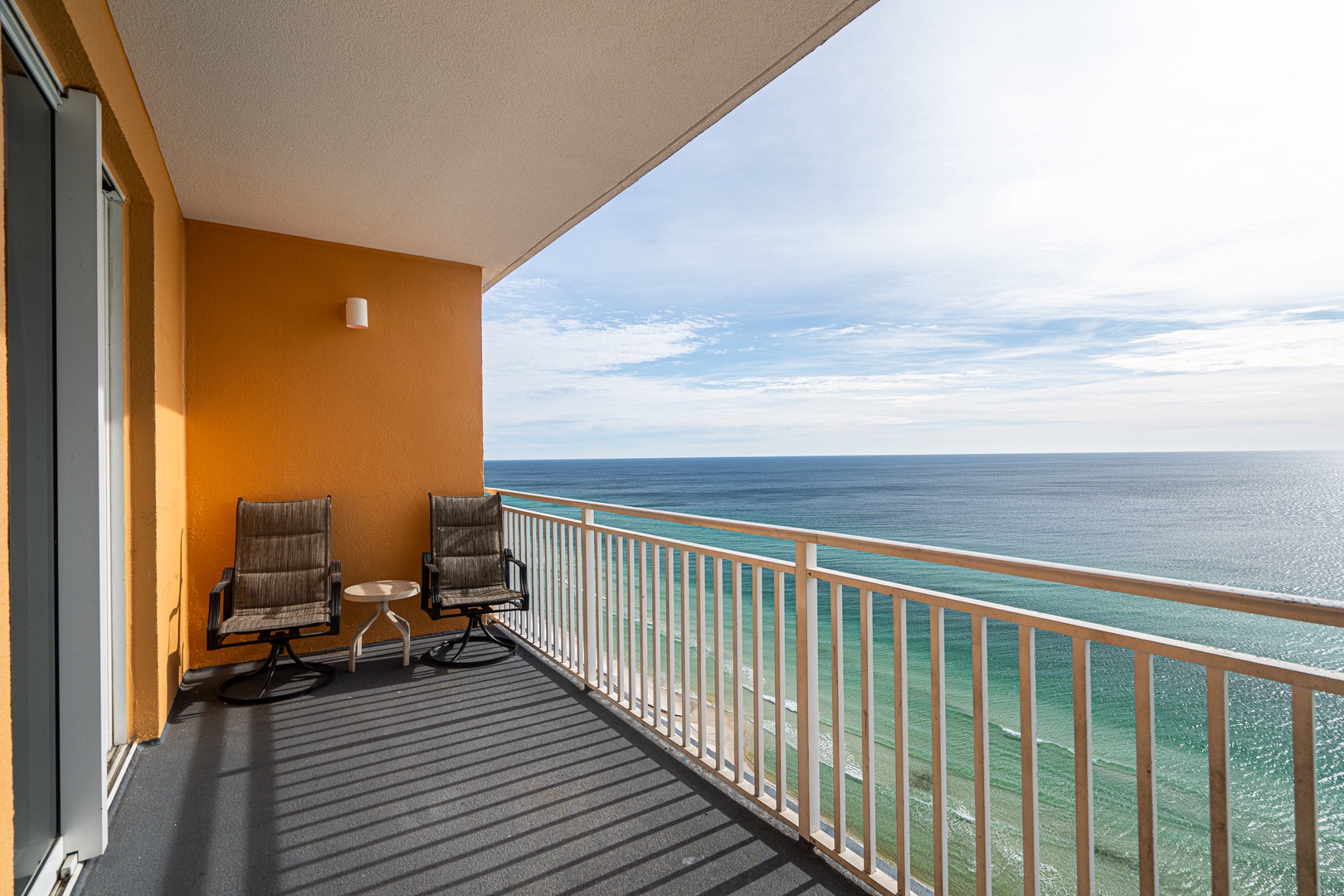 Step out onto the private balcony & lounge with stunning ocean views