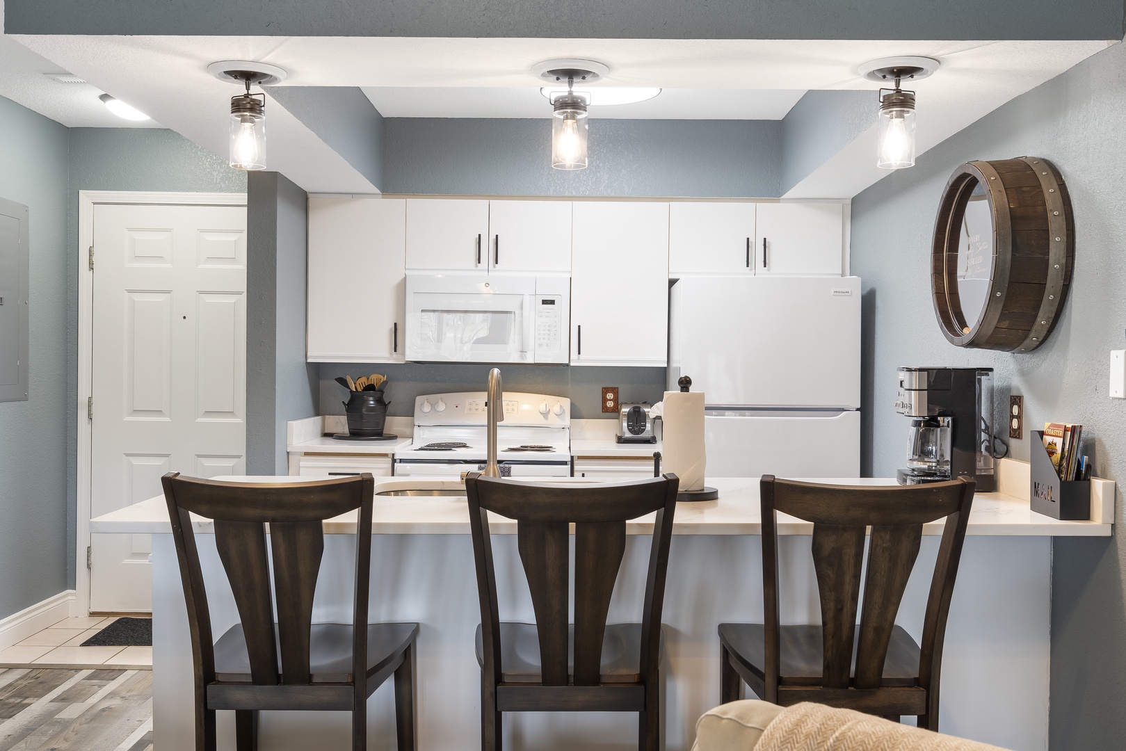 Sip morning coffee or grab a bite at the kitchen counter, with seating for 3