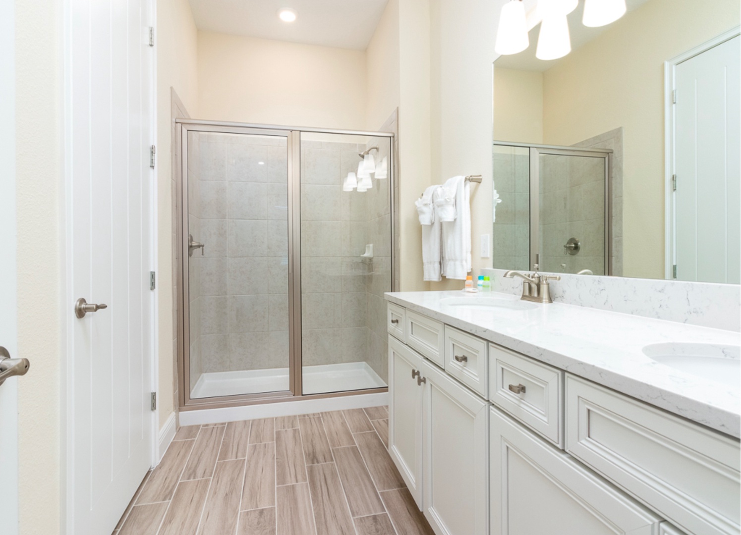 A double vanity & shower await in this large ensuite bath