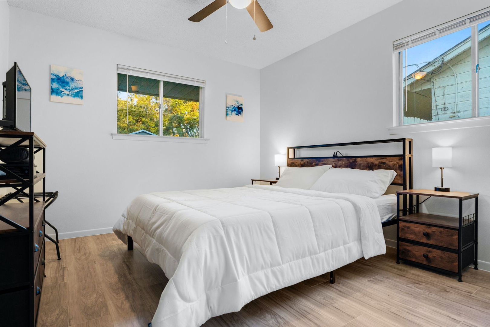 The final serene queen bedroom includes a Smart TV & ceiling fan