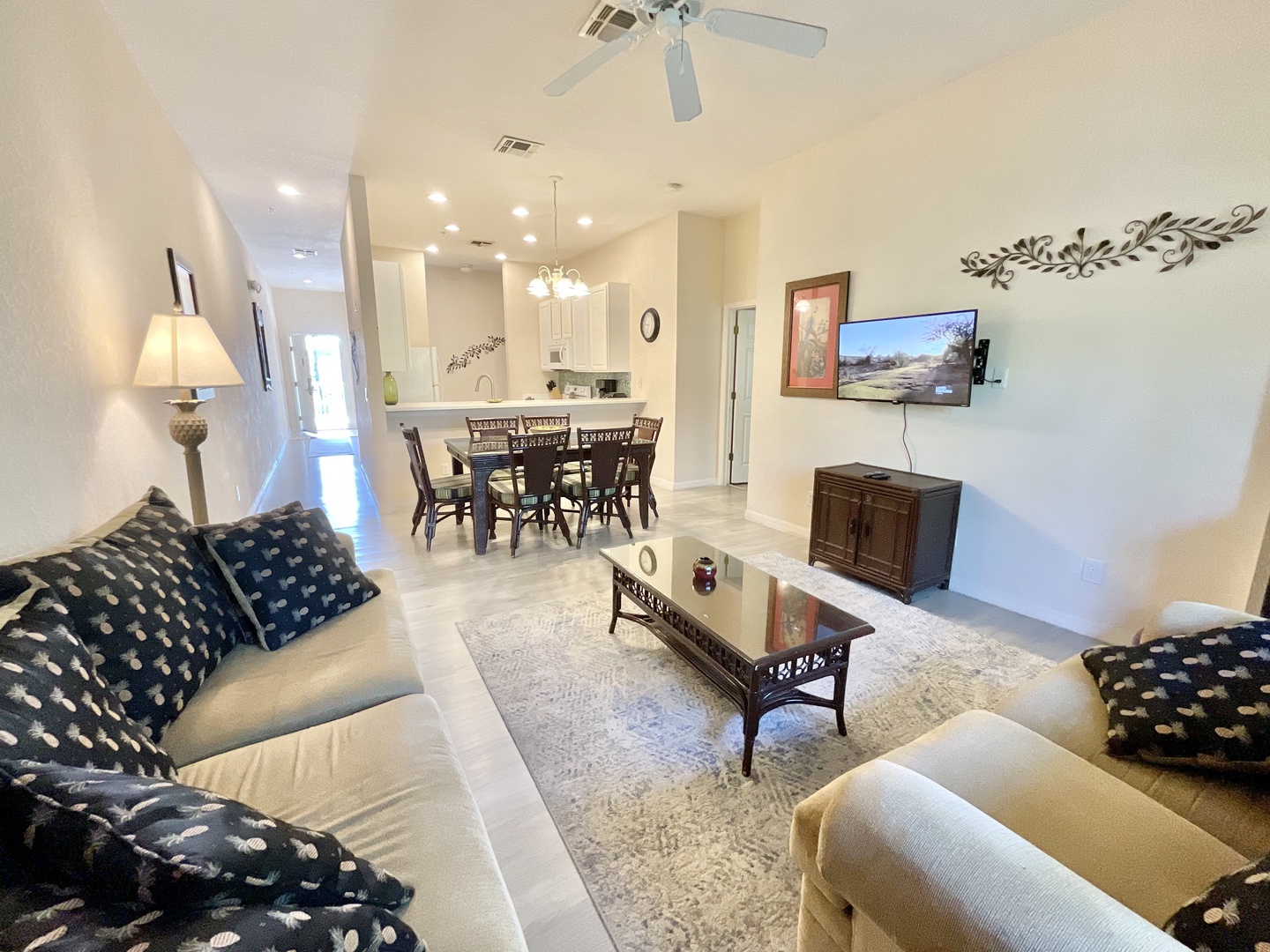 Bright living area with ample seating and Smart TV