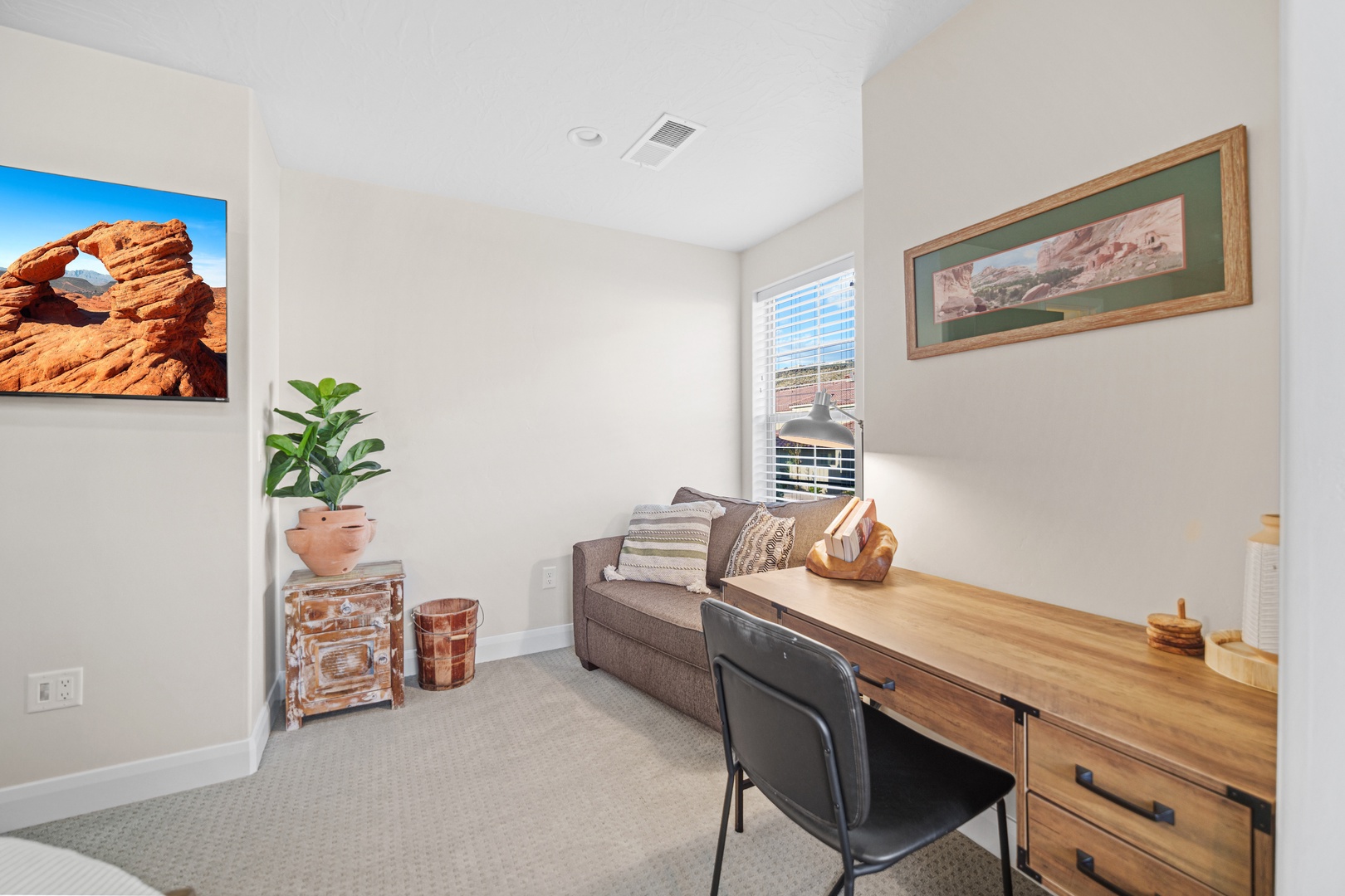 Bedroom 2 with king bed, workspace, Smart TV, and ensuite