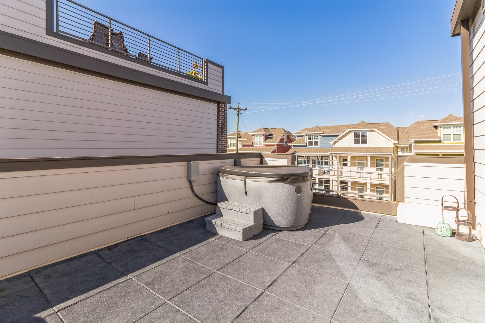 Step out onto the 2nd-level rooftop deck & soak your cares away in the hot tub