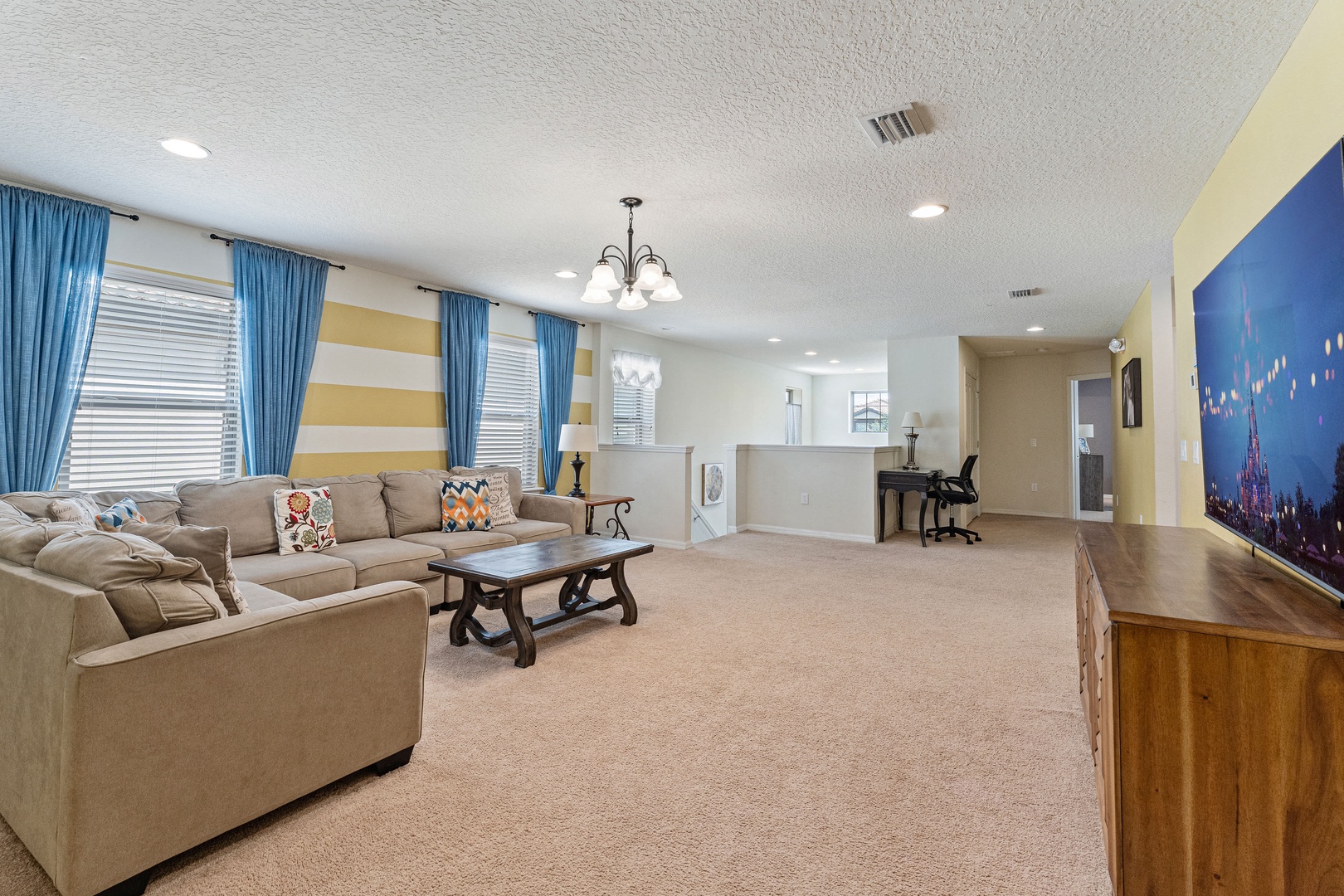 2nd floor living space with sectional sofa and Smart TV