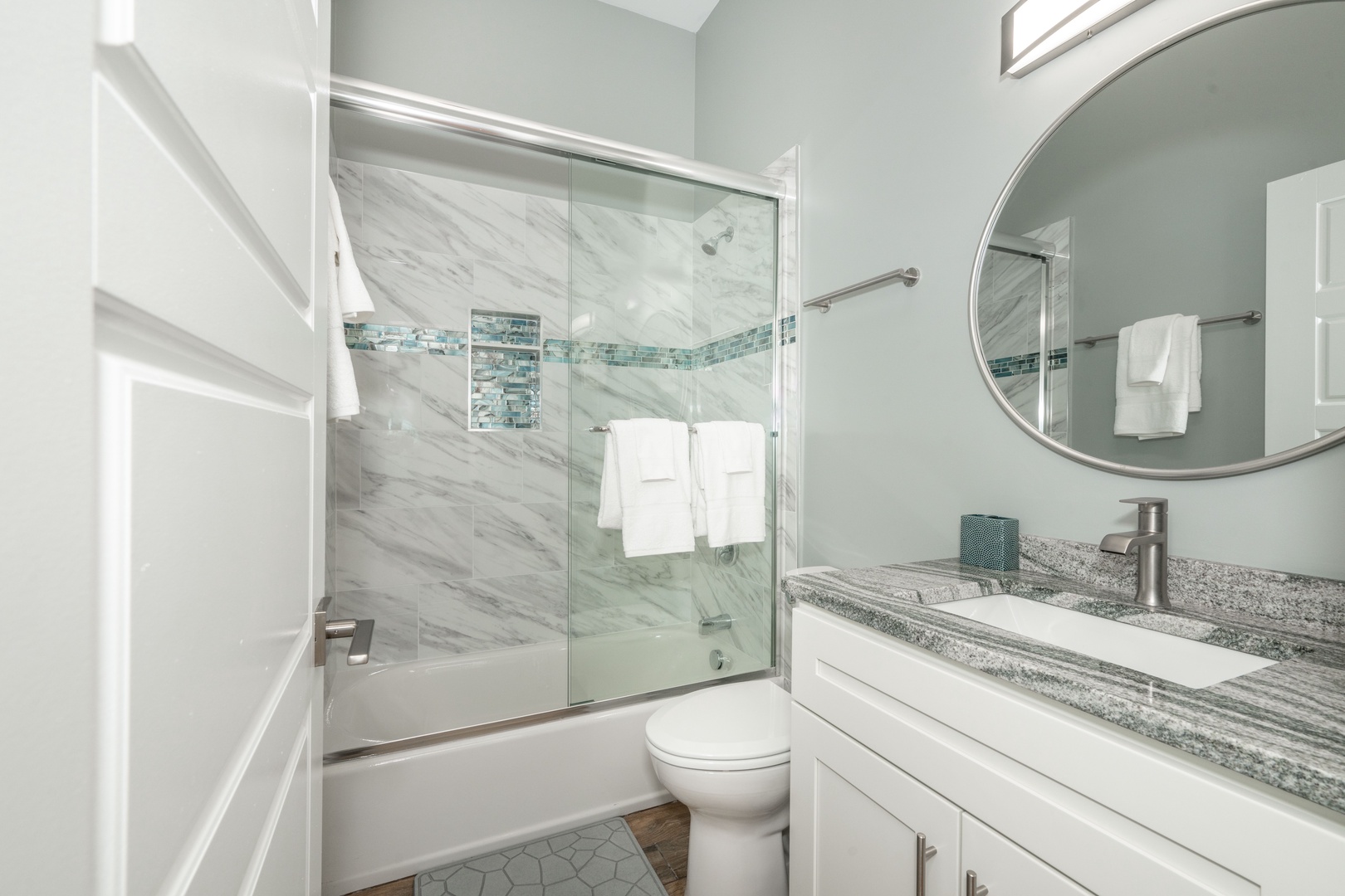 This ensuite bath features a single vanity & glass shower