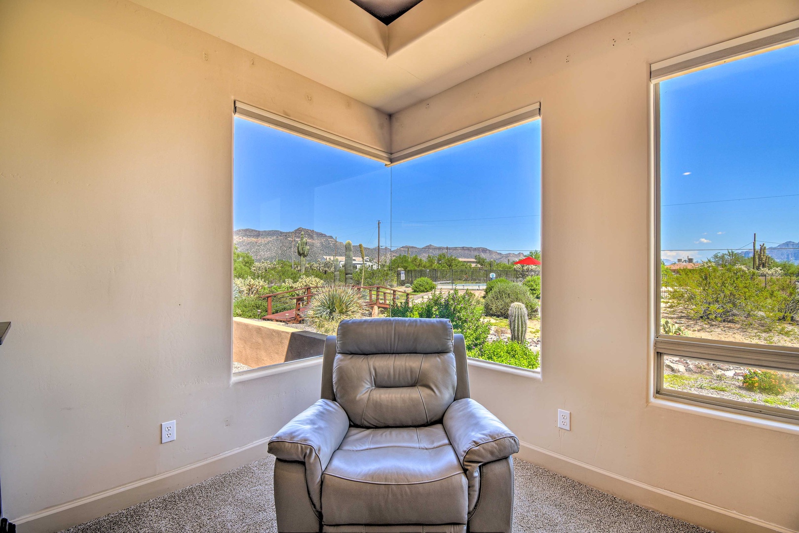 The primary king suite boasts mountain views, a private ensuite, & Smart TV