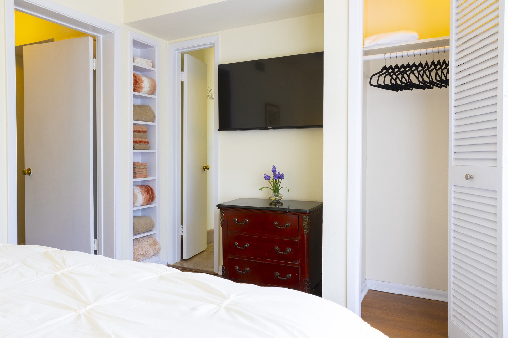 The second bedroom retreat features a plush queen bed & smart TV