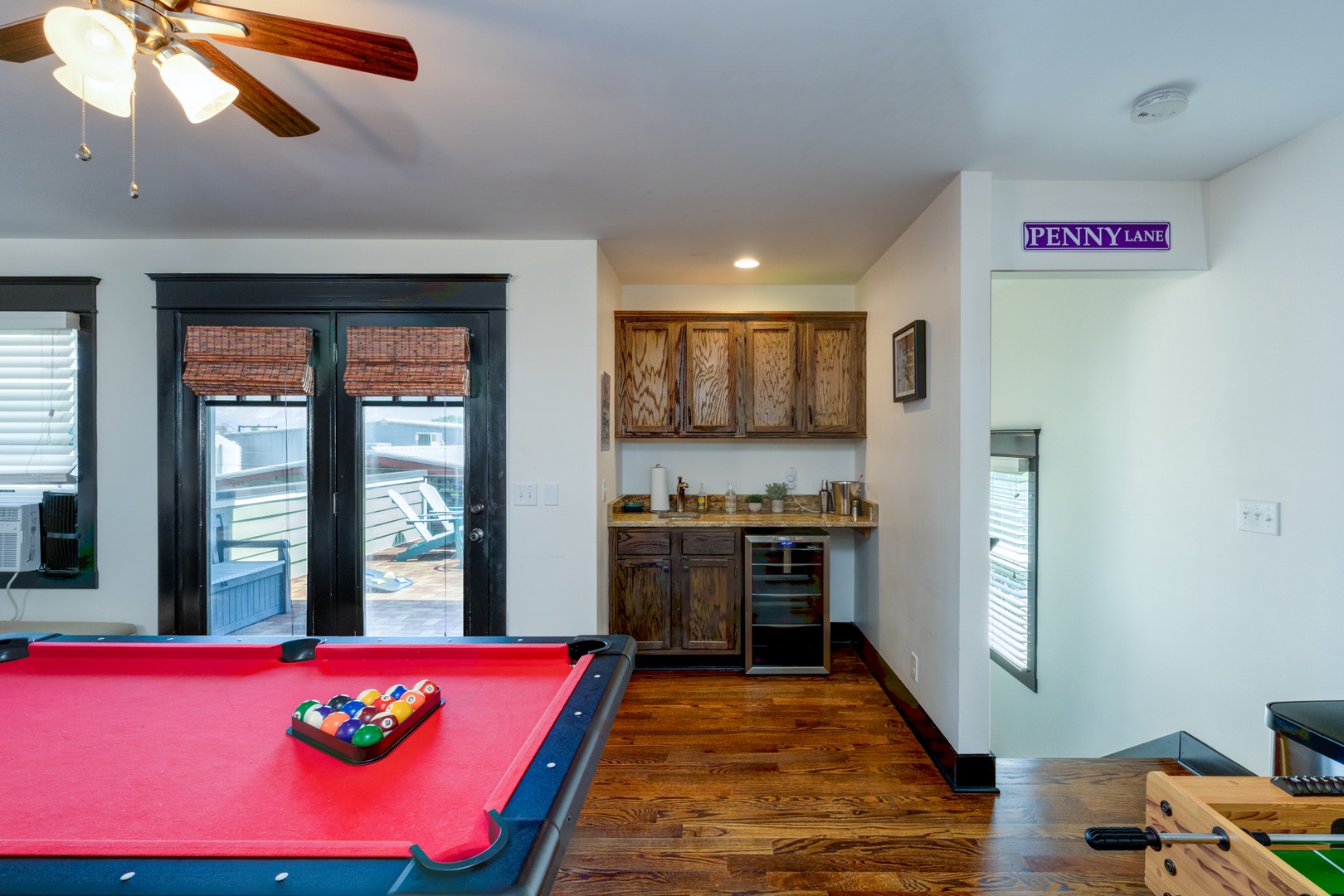 Third Floor Game Room offering Twin Bed & Trundle, Foosball, Pool Table, Smart TV, and Mini Bar Area