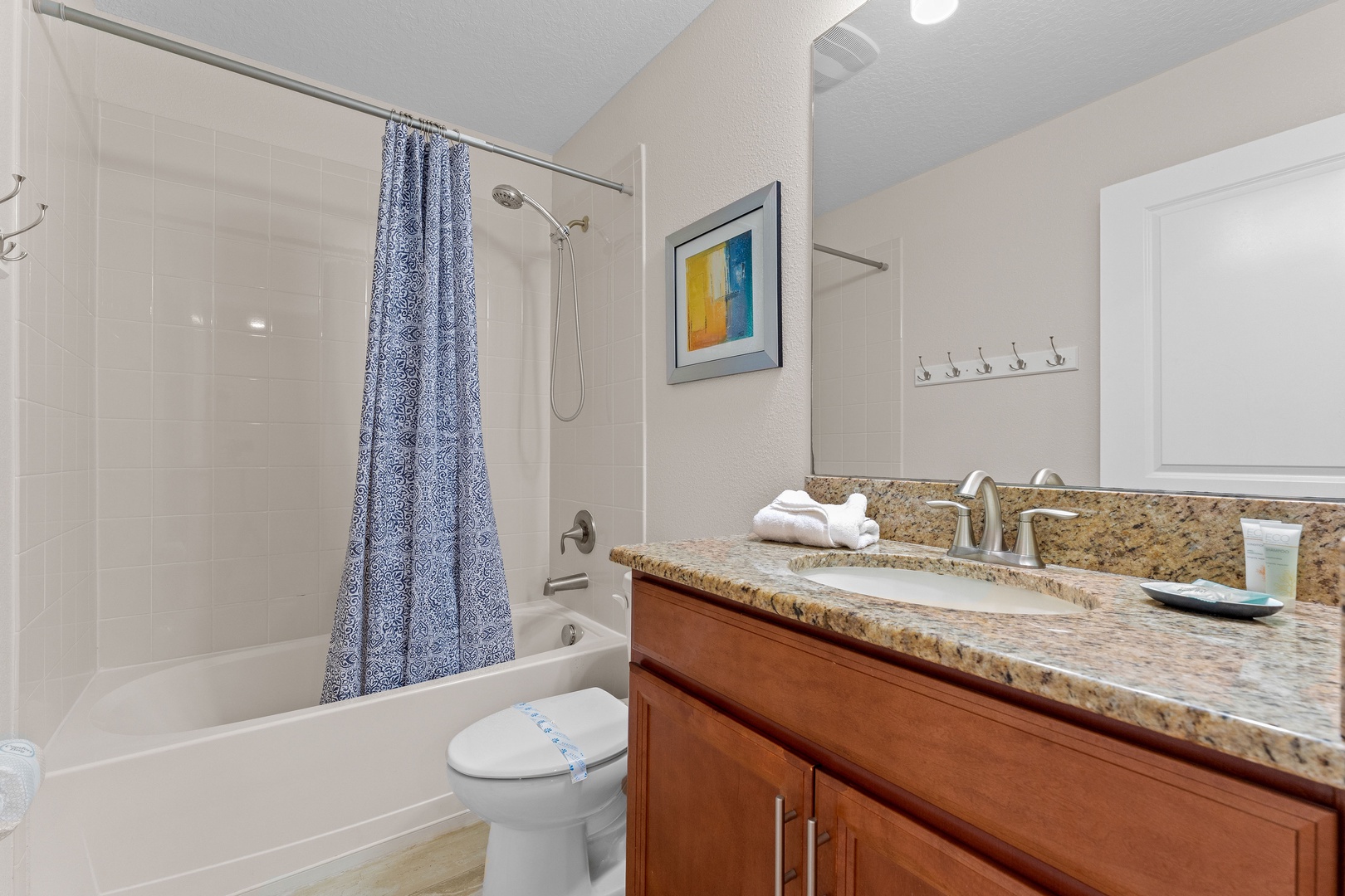 Shared bathroom with shower tub combo