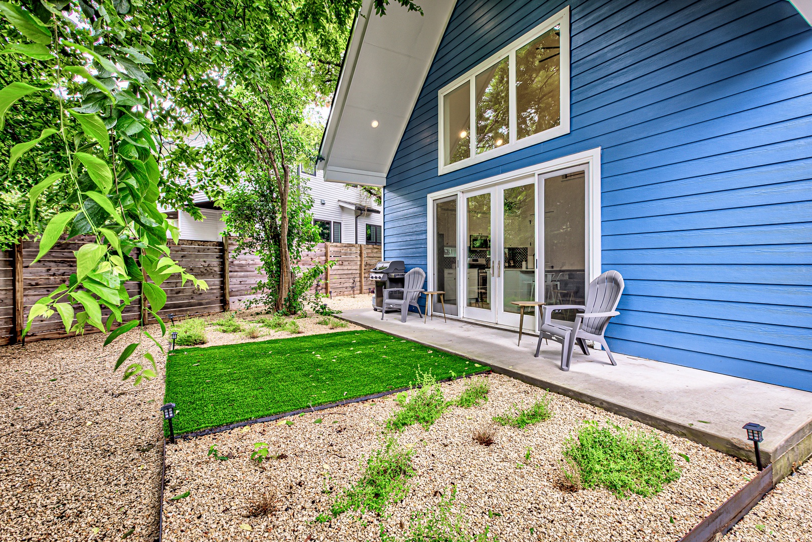 Relax and unwind in this serene backyard