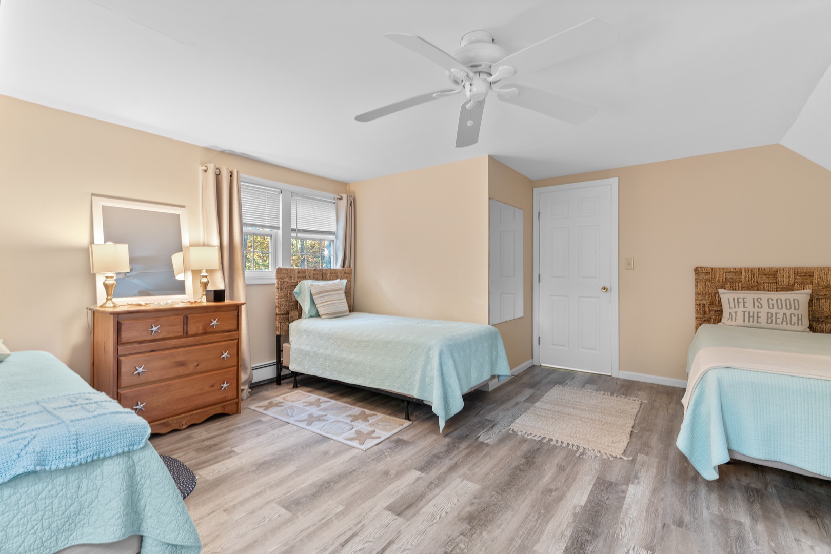 The final 2nd floor bedroom offers three cozy twin beds