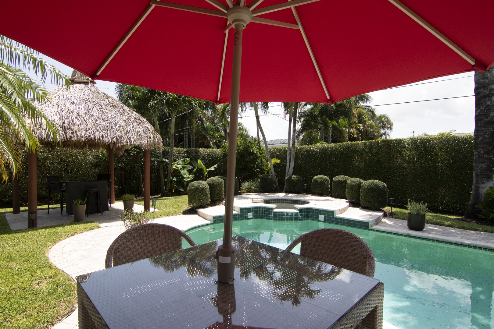 Ample outdoor dining with seating by the pool