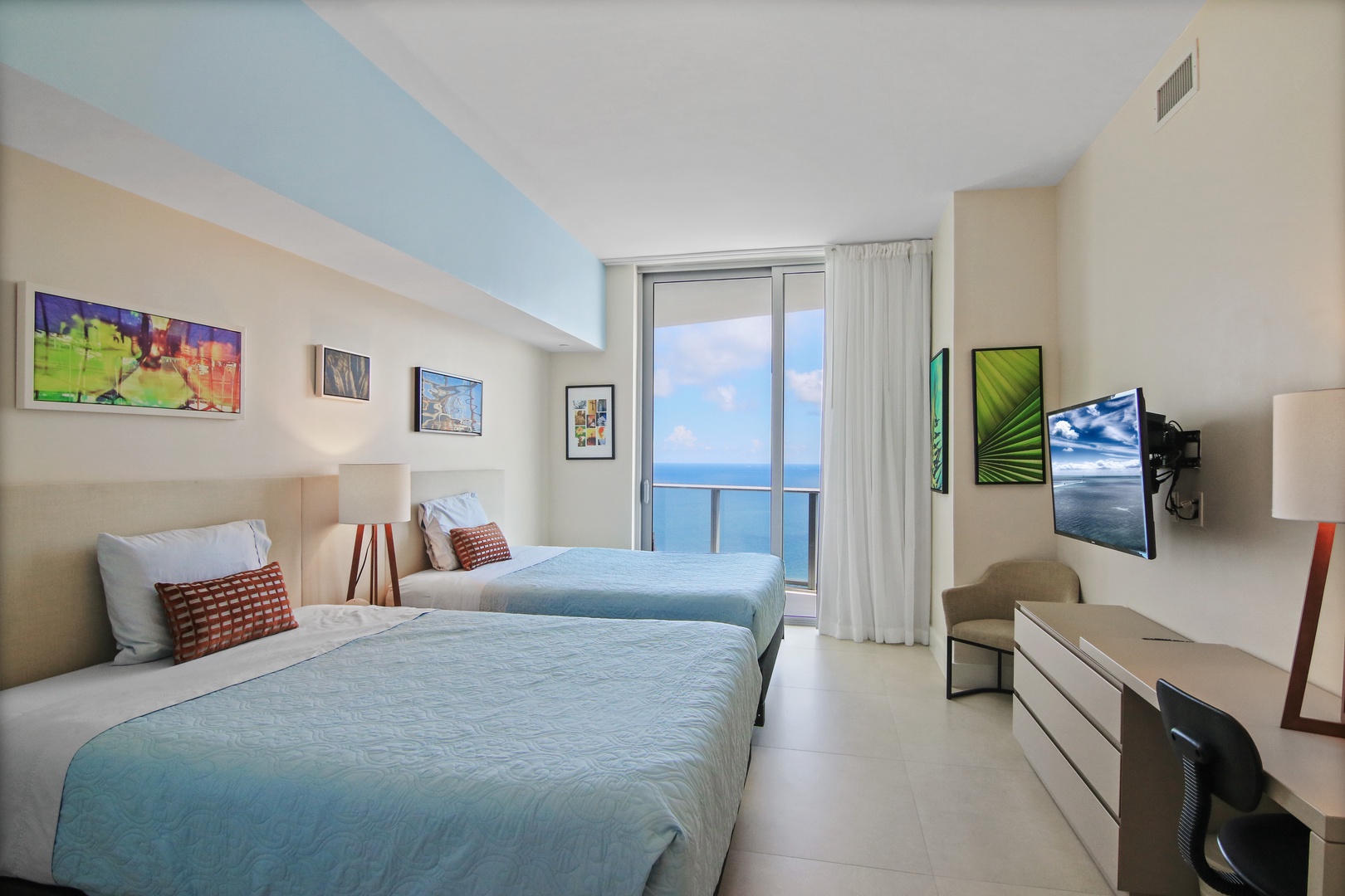 The 2nd of 2 double queen bedrooms offers a Smart TV, desk, & balcony access