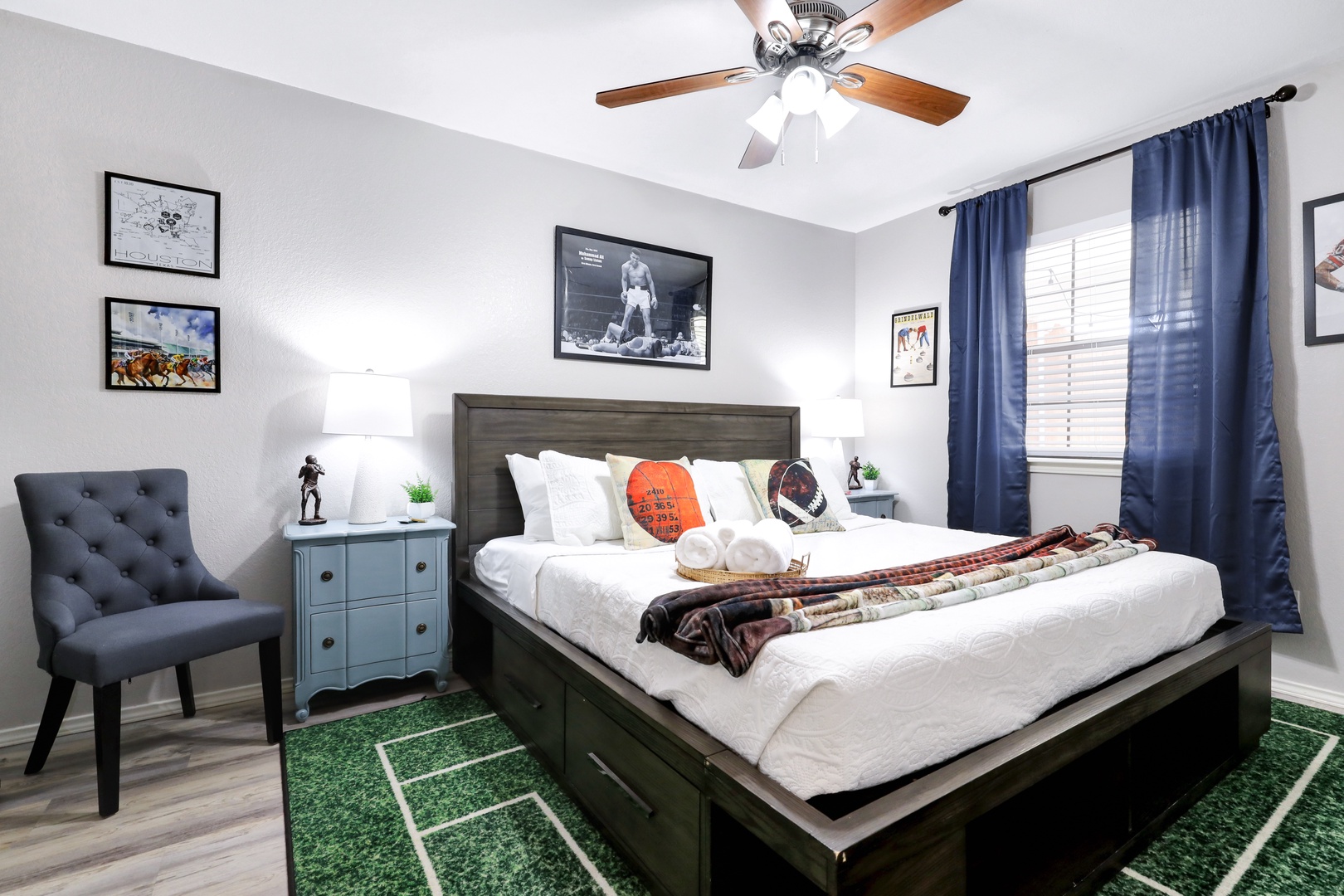 Sports-themed luxury bedroom retreat with a king bed & Smart TV