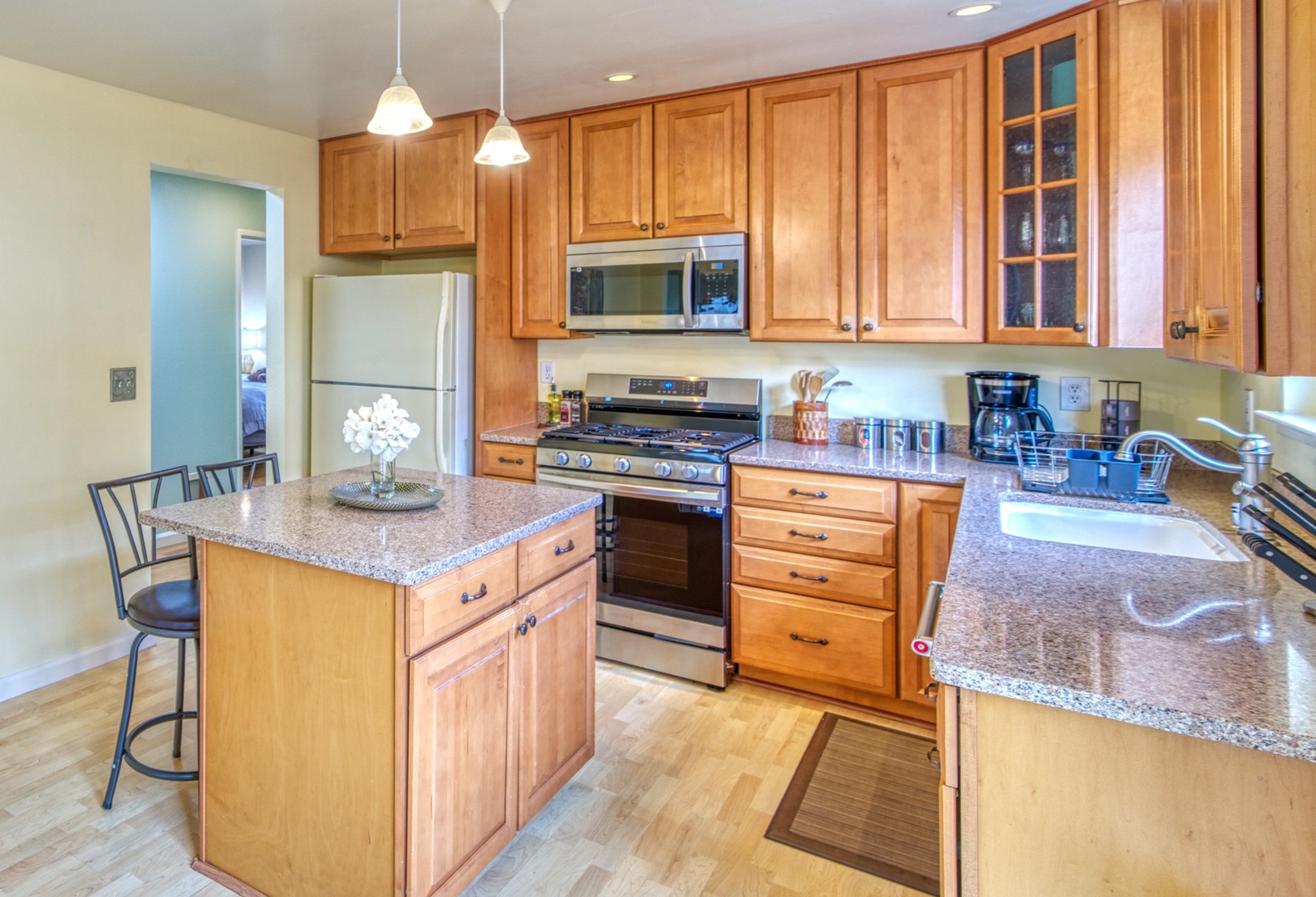 The open, airy kitchen offers ample space & all the comforts of home