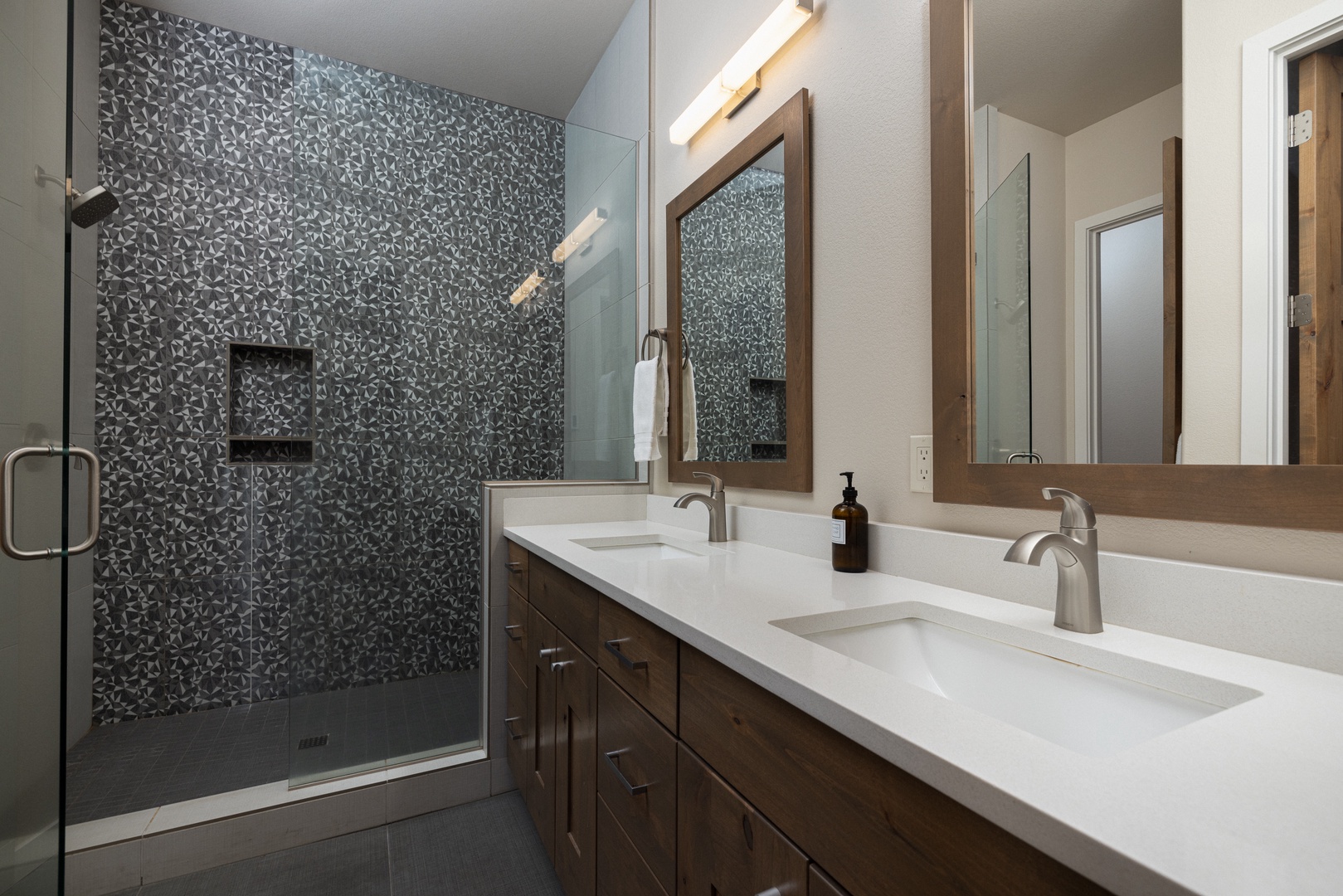 A double vanity & luxurious glass shower awaits in the 1st floor ensuite