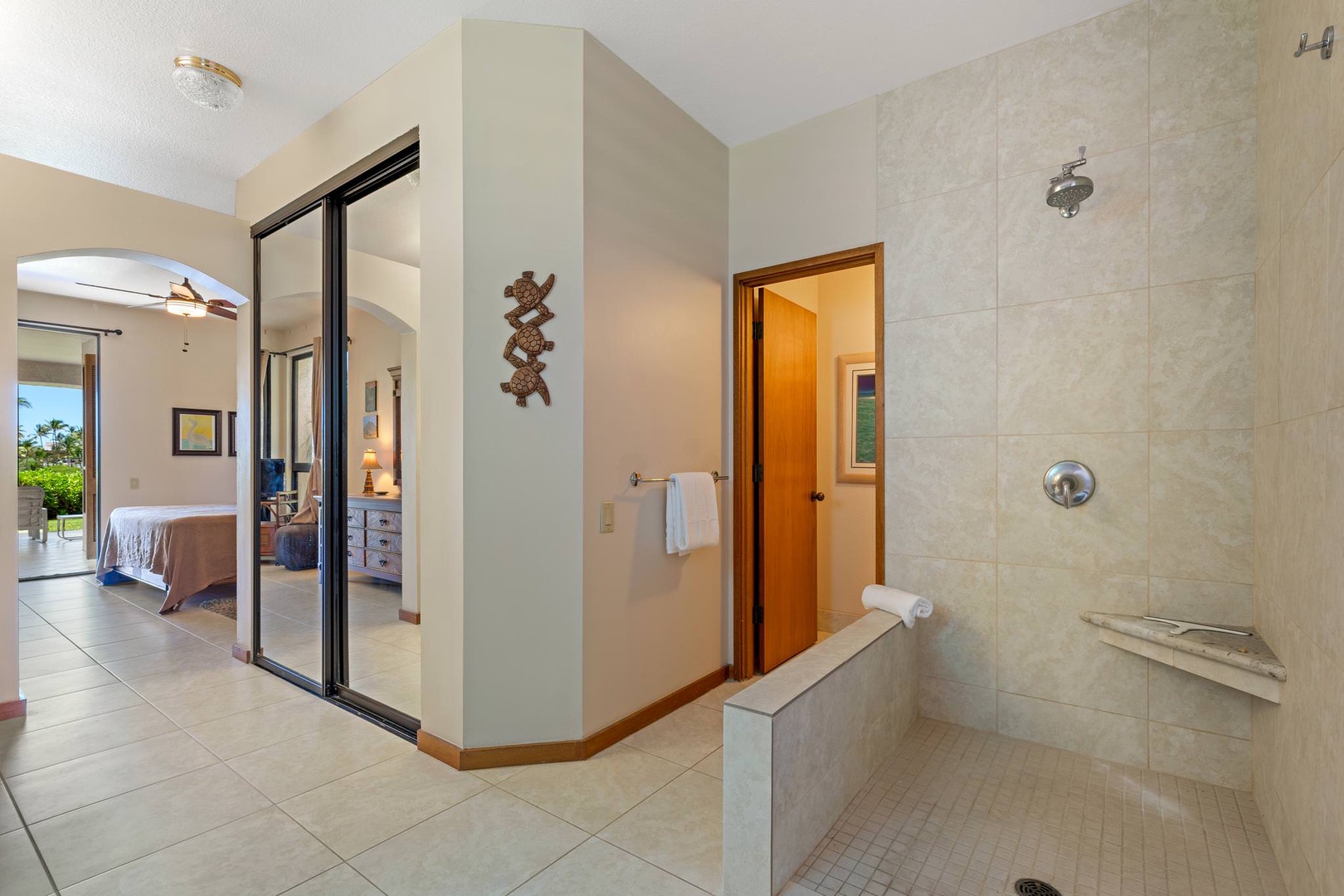 En suite bathroom with open standing shower, dual sinks