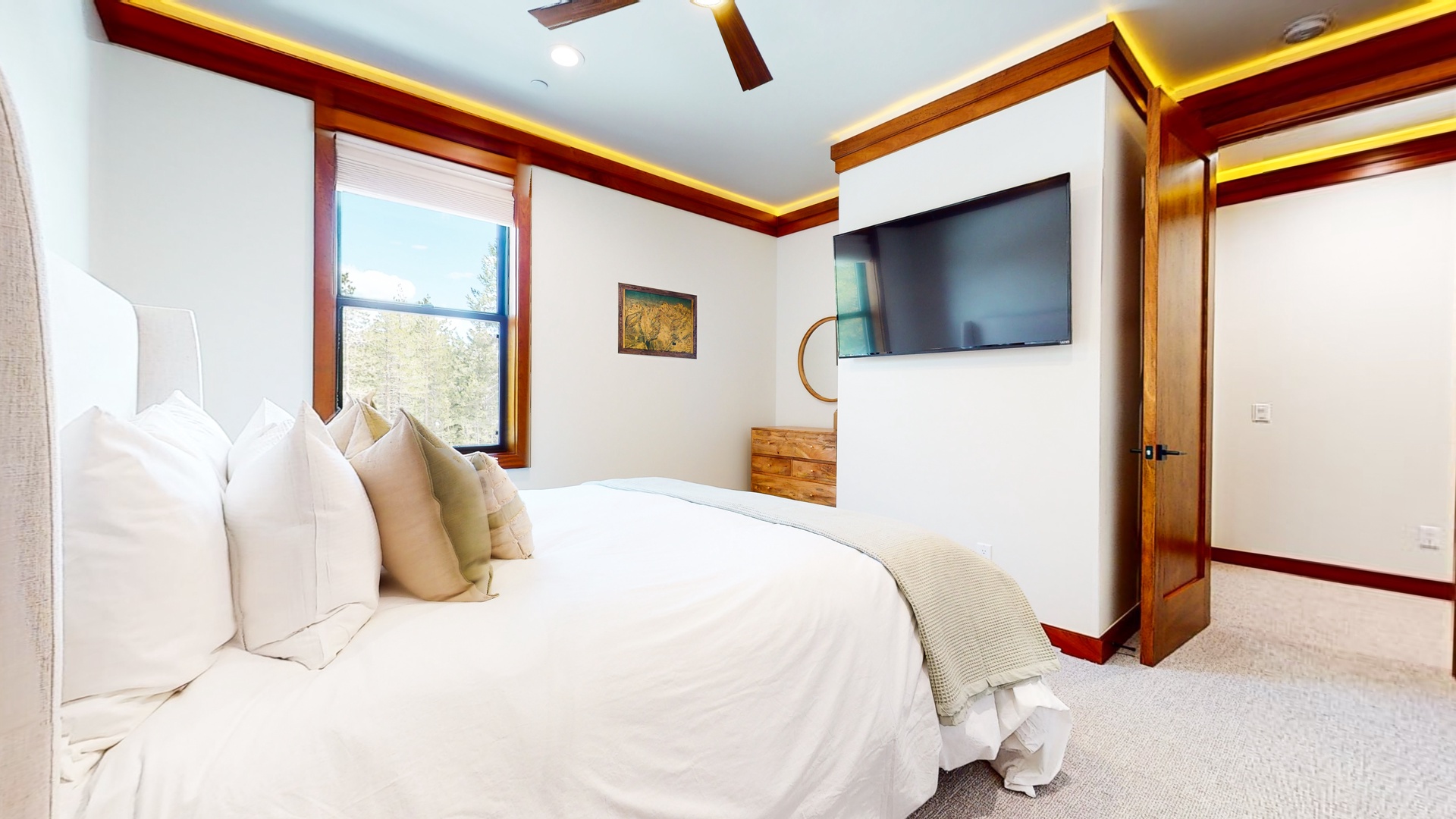 The tranquil 3rd floor king bedroom offers ample space and a Smart TV