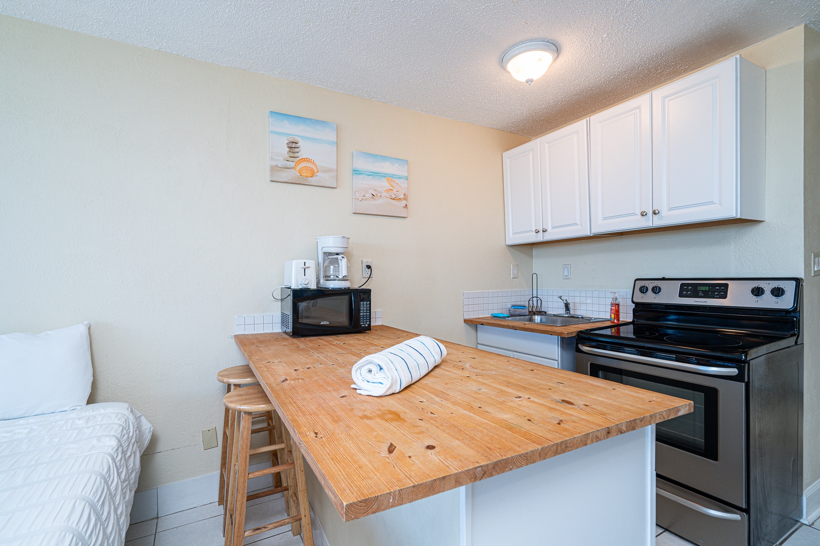 The kitchen offers ample storage space & all the comforts of home