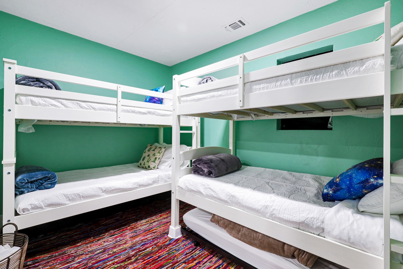 The guest house bunk room offers 2 twin-over-twin bunkbeds & a twin trundle