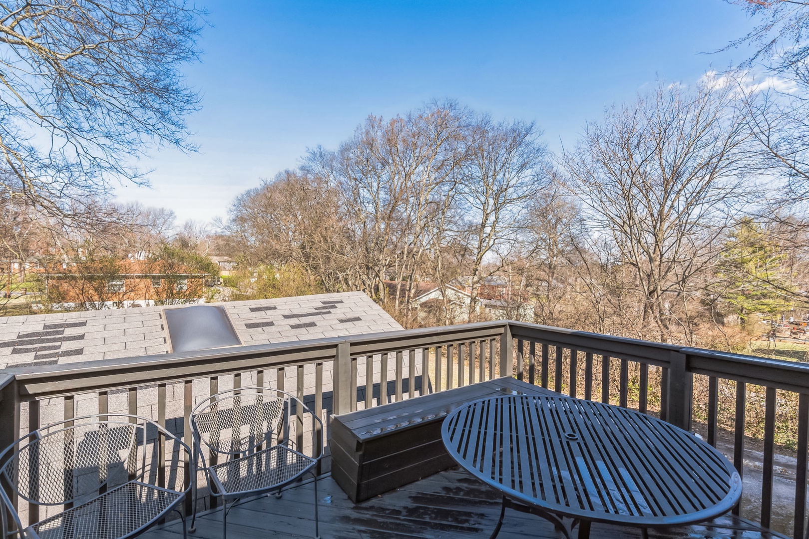 Retreat to the deck and soak in the scenic backyard
