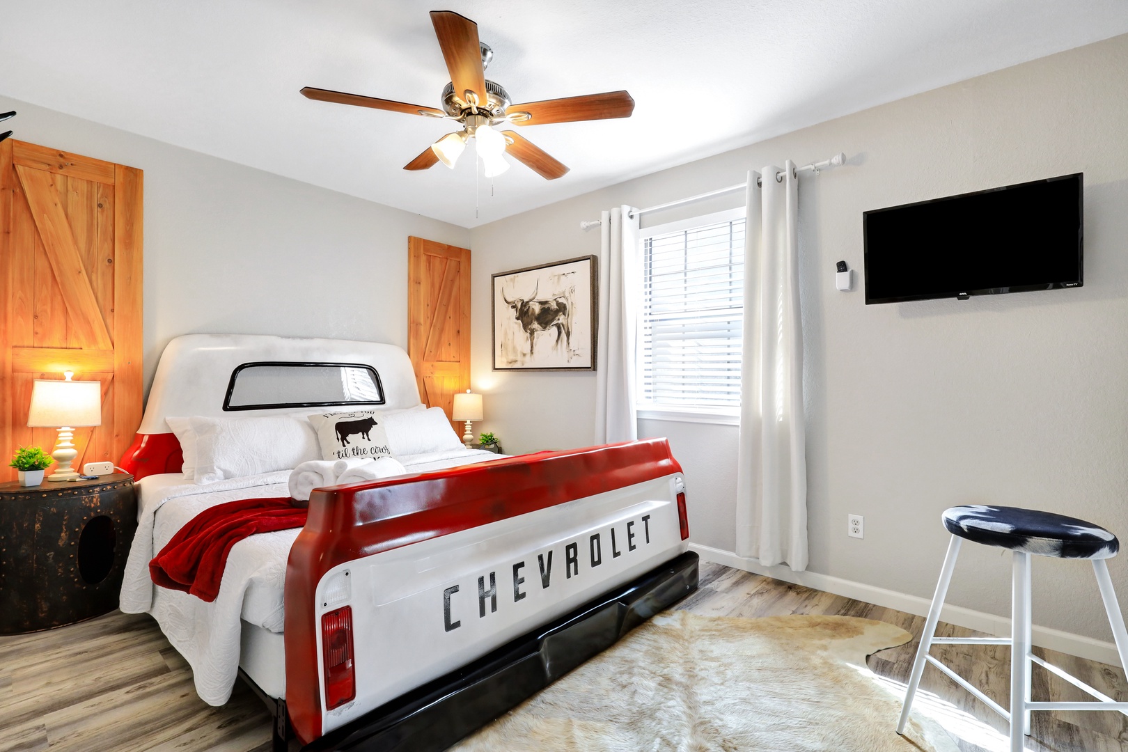 This 1st floor bedroom retreat showcases a plush king bed & Smart TV