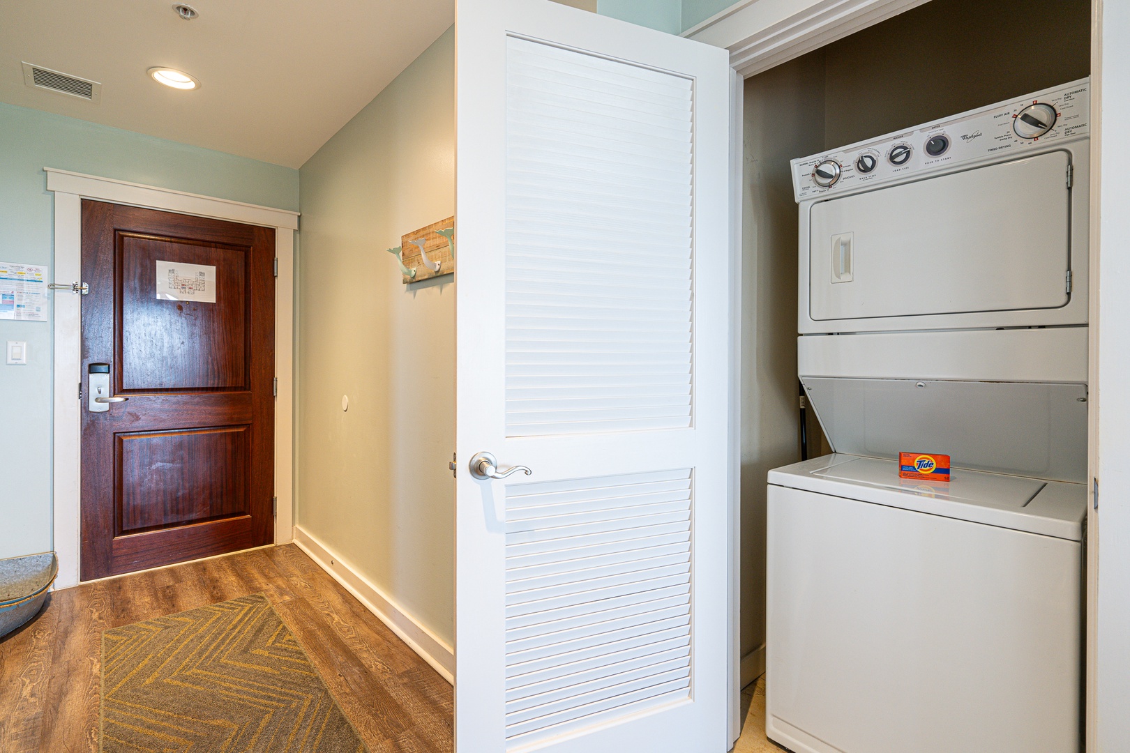 Private laundry is available for your stay, tucked away near the entryway
